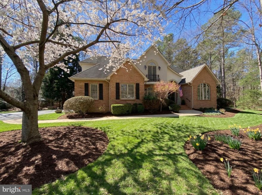 Located inside the luxurious gated Fawn Lake Community, this Gorgeous French Country Residence captures timeless elegance and grandeur from every angle. 
Built by the renowned Sandy Sagun, this custom solid brick Dream Home with a gorgeous exterior facade, complete with a Juliet Balcony and a stunning front door  features a sunlight interior graced with timeless architectural details, solid Oak hardwood floors, rich mouldings, archways, built-ins, and artfully curated living spaces filled with abundant comforts and beautiful design elements throughout.  Offering a beautiful and flowing floor plan with a desirable main level Owner's Suite and charming spaces for elegant yet casual everyday living and entertaining.    
Exuding curb appeal, this Residence is perfectly nestled on a .68 Acre lot filled with lush landscaping and an array of flowering shrubs and the most beautiful flowering trees highlighting the exterior of the property. Sited in a very desirable established area, along a scenic Cherry tree-lined sidewalk, just a stroll to the pool, beach, tennis courts, driving range, and the Fawn Lake Country Club Restaurants! 

Stepping through the custom double front doors, an elegant two-story Foyer with stunning archways and diamond pattern black and white marble floors welcomes you, and sets the tone from the moment you enter.   An elegant Dining Room with tray ceiling and stately columns offers the perfect setting for formal gatherings. The beautiful Den with vaulted ceilings features custom-built Bookcases and tall Palladium windows, inviting brilliant sunlight.  
The spacious Family Room features a stunning Fireplace anchored by built-in media cabinetry, and a wall of windows and French doors leading to the deck and peaceful backyard.
The Gourmet Kitchen with Maple cabinetry, and a center butcher top island offers plenty of space to prepare and cook meals. The cozy Breakfast nook with large windows offering views of the backyard, features French doors leading to the Screened Porch and the rear deck. 
A true sanctuary, the expansive Primary Suite features two walk-in closets, a spa bath with double vanities, tile shower and a soaking tub for relaxing. 
The upper level includes Three gracious Bedrooms with large windows, walk-in closets, and a shared Full Bath with dual sinks. 
With unlimited possibilities, the unfinished Basement offers an additional 1,500 SQ FT of space for storage and future expansion!
The backyard sanctuary offers an idyllic space for extended outdoor living and entertaining, a screened porch and spacious deck with with a wisteria covered arbor are ideal for alfresco dining, lounging, and taking in the sights and sounds of nature. 
An oversized 2-Car Garage and extended driveway provide ample parking. Recent updates include: New washer and Dryer. 2019- Water Heater & Sump Pump. 2014- HVAC.  Home is equipped with a built-in generator for ease of mind.  The grounds are easy to maintain with the in-ground irrigation system. Live with ease in this well appointed and thoughtfully designed architectural gem that fuses luxury and sophistication with tranquil living.  
Come experience what the Fawn Lake lifestyle is all about where every day is a vacation! 
The luxury and vibrant Fawn Lake Community offers amazing amenities such as a boating recreational lake, sandy beach, an Arnold Palmer Golf Course, pickleball and tennis courts, baseball and soccer fields, dog park, volleyball courts, walking trails, Community ClubHouse, marina, fitness center, restaurants, Country Club, playgrounds, and more!  With an array of clubs, groups and daily activities, you will have plenty of opportunities to join the social scene, make new friends and remain active! Located in the countryside near the town of Fredericksburg, surrounded by park lands and only a few miles to the farm market, wineries, and award winning breweries! Conveniently located to shopping, restaurants  and top-rated Riverbend District schools and I-95!