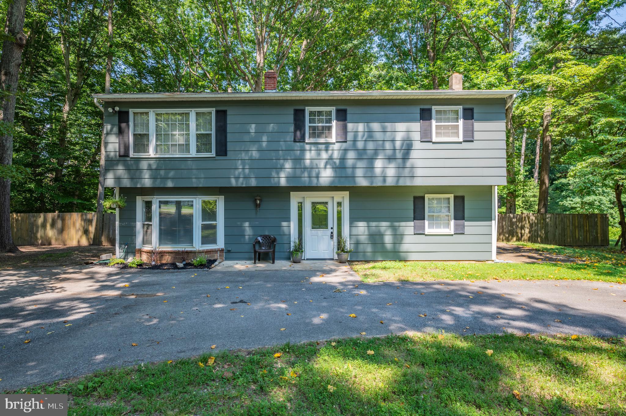 This 3 Bedroom, 2 1/2 Bath 2-Level Home has been Beautifully Updated. The Foyer Entryway Welcomes you into this Wonderful Home. The Lower Level has a Carpeted Office with a Bay Window. The Large Family Room has Recessed Lighting and Access to the Enclosed Patio that Opens to the Backyard. There is also a Full Bath, Laundry Room and a Utility Room for Lots of Storage. Upstairs has Gorgeously Hardwood Throughout. The Kitchen has Plenty of Counter Space and has been Completely Remodeled with New Cabinets, Stainless Steel Appliances and a Breakfast Bar with a Butcher Block Top. Dining Room and Living Room have Plenty of Natural Light. Enjoy Entertaining or Relaxing on the Huge, Upper Level Deck Overlooking a Large Level Backyard. Master Bedroom has a Spacious 1/2 Bath. Two More Bedrooms are Upstairs and a Remodeled Hall Full-Bath. No Through Traffic. Convenient to PAX, Shopping, Commuter Lots, Shopping and Restaurants.