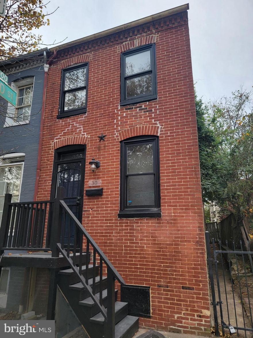 This is a newly restored 2 bedroom, 1.5 bath end unit in historic Hollin's Market. Discounted rent possible with a multi-year lease. The beautiful property features new wood floors, a super modern spiral staircase, 2 decorative fireplaces, freshly painted throughout, a modern kitchen with refrigerator, stove, microwave, and  dishwasher.  Washer/dryer also included on top level and so much more! For security the property includes security storm door on back deck and fenced-in backyard.