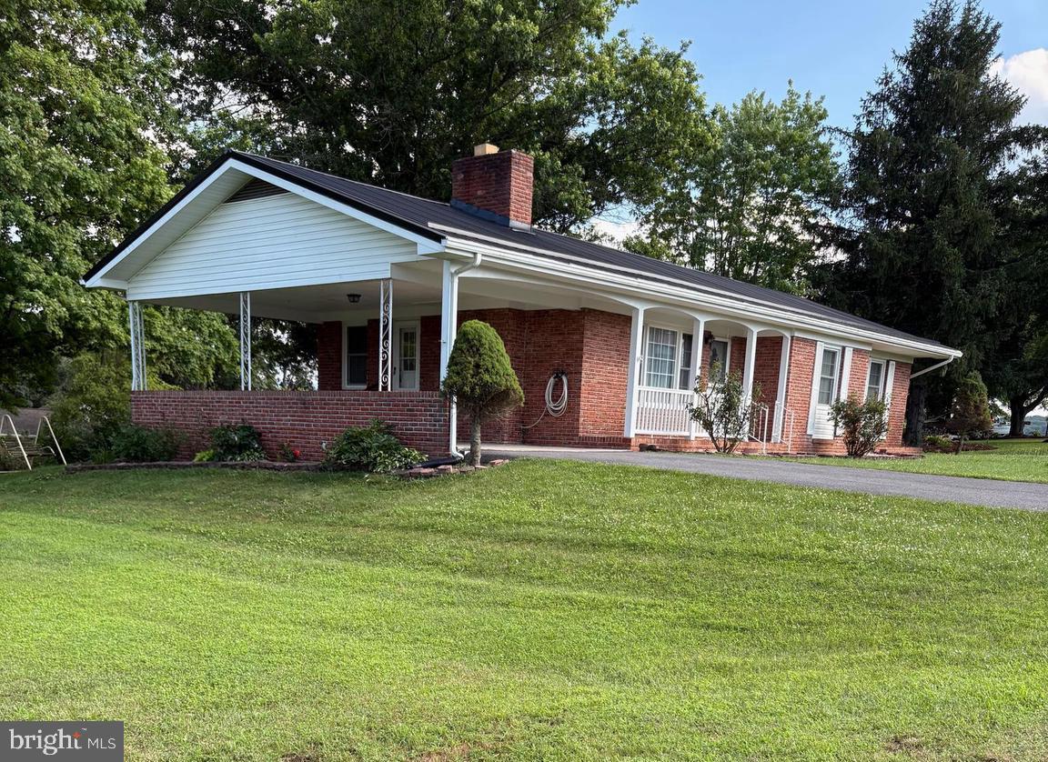 Beautiful, newly remodeled home in a well established subdivision. Located near town, near hospital, post office, schools and dining. New metal roof, new windows, beautiful hardwood floors, freshly painted., new bathroom upgrades. Window blinds and curtains convey. Partially finished basement. Don't miss out on this opportunity. Beautiful home, lawn and location!!