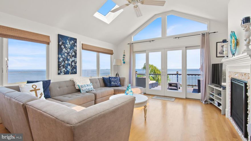 Spectacular sunrises over the Bay!  This shorter or longer term rental vacation home offers 180 degree views of the Bay, boardwalk, DT North Beach, etc!  Open floor plan with 9 foot and cathedral ceilings!  Gourmet kitchen with granite counters, large center island and opens up to the livening room with cathedral ceilings, walls of windows & skylights! Gas fire place too!  Double opening slider opens to the spacious deck with amazing views!  Finished walk out basement too with family room, bed- & full bathroom, patio and hot tub!  Lots of windows & light in the lower level too! Recessed lighting and fresh neutral paint colors throughout. Boardwalk access is a few houses down the street. Take boardwalk; right to Brownies Beach & left to end of boardwalk; then walk up to and take a right on C St to Chesapeake Beach Resort, Rod & Reel, Marinas; with boat, kayak, paddle board & bicycle rentals, Shops, Restaurants, Tiki Bar, Water Park, Hiking Trail, Bank, Post Office, Library, Verizon store, Hair & Beauty salons, McDonalds, Subway, etc!  Some of my favorite local restaurants in Chesapeake Beach are; The Rod & Reel, Boardwalk Cafe & Tiki Bar,  the new 1936 Restaurant with really nice canal & coastal water views & Bay Front Baia Coastal Italian Kitchen & Wine Bar, with tiki bar & rooftop dining! North Beach; The brand new Sliders restaurant with big wrap around porch, Hook & Vine fine dining, The Wheelhouse Beer & Wine Garden with heated patio & live music. I also love Ketch22 restaurant & tiki bar at Herrington Harbour Marina & Resort; with nice marina & pool views. My favorite dish is pork tacos in lettuce wrap.  Chesapeake Beach Resort Spa boat, jet ski, bicycle, kayak & paddle board rentals at Marina West. Also fishing tours are organized out of the Chesapeake Beach Resort & The Rod & Reel! Vacation life style all year round!! : )