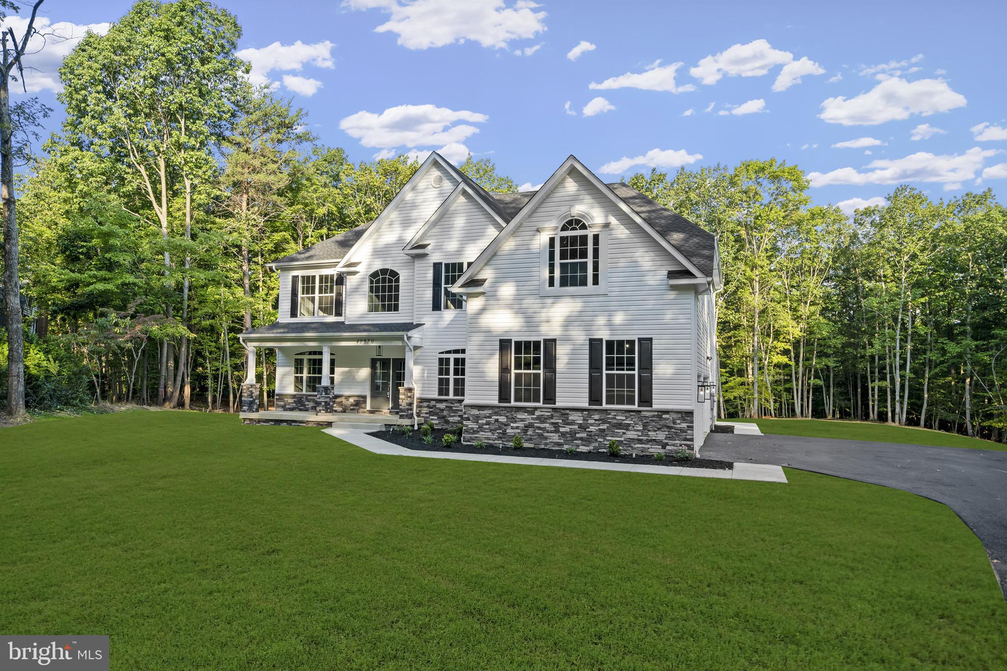 TO BE BUILT - Introducing the "Patriot," a magnificent 4-bedroom, 2.5-bathroom abode spanning 4,058 square feet of luxury living. As you step inside, you are greeted by an open layout that radiates warmth and spaciousness. The heart of the home, a two-story family room with fireplace, is bathed in natural light, creating an inviting atmosphere for entertaining and relaxation.
Cook gourmet meals in the chef-inspired kitchen, featuring 42" custom-designed cabinets, granite countertops, and a generous island, making it a hub of creativity and connectivity. There's also a convenient mudroom connecting the garage and kitchen, simplifying the task of unloading groceries.
The first level boasts a large two-car garage, a beautiful hardwood-floored foyer leading to the main staircase, a formal living room with a bay window, and a spacious formal dining room. This design provides the option of an in-law suite or a study with an attached bathroom, catering to the needs of a growing family or those who work from home. Additionally, a sunroom off the kitchen offers a tranquil space to enjoy the beauty of every season.
On the second floor, the king-sized master suite is a sanctuary, featuring a seating area, dual walk-in closets, and a master bath that is nothing short of luxurious. The master bath includes ceramic tile flooring, a custom tile shower, a soaking tub, and dual vanities. This is a space dedicated to unwinding and pampering yourself.
The second floor also hosts three more generously sized bedrooms, each with its own walk-in closet. With two of the bedrooms sharing a Jack and Jill bathroom, providing comfort and convenience for family and guests alike.
Enjoy the incredible location, only 8 min from downtown Leonardtown, easy access to 243, and minutes from Brenton Bay!
Your home is more than a building; it's an expression of your unique personality and lifestyle. With Litz Custom Homes, your vision becomes a reality, and 40533 Breton Knolls Court is your canvas. Embrace the opportunity to design your perfect living space and experience the joys of true customization. This is not just a house; it's your future home, waiting to be sculpted into your personal masterpiece. Please note that the images of the house are for illustration purposes only, finishes are upgrades and will be priced separately.