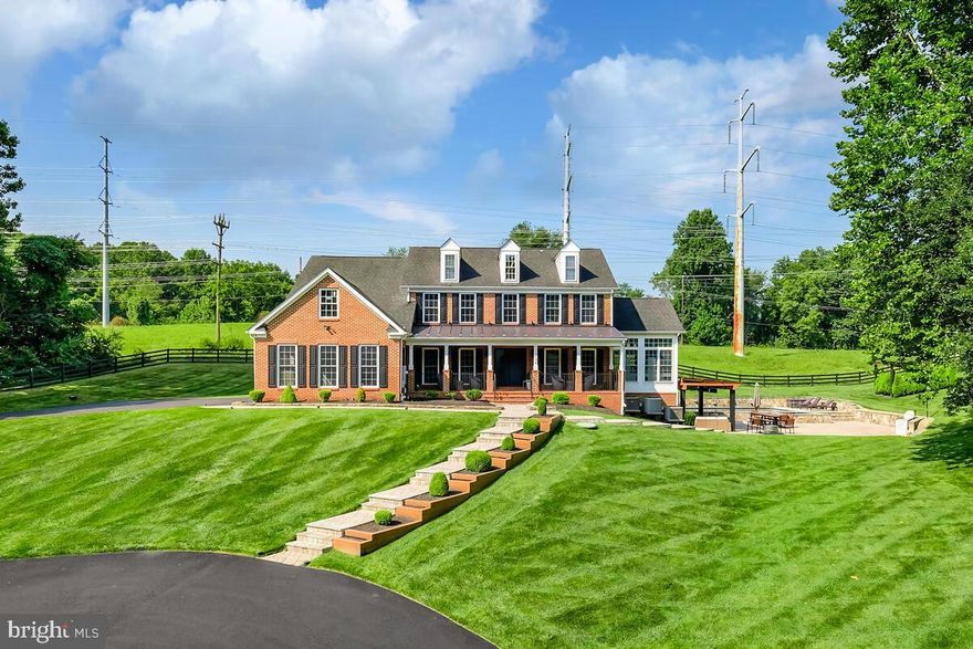 Nestled at the bottom of a quiet cul-de-sac, a long circular driveway welcomes you to this awe-inspiring house on the hill.

Indulge in the exquisite blend of high-end contemporary design and intimate living in this stunningly renovated home. Step inside to find immaculate Brazilian hardwood floors and lofty ceilings complemented by an abundance of bright oversized windows. Experience the finest in architectural detail and quality craftsmanship, evident in the extensive upgrades on all three levels.

The main level seamlessly combines spacious living and dining areas, perfect for grand gatherings and intimate moments. The fully-equipped kitchen with luxury Miele appliances and the adjacent family room with high ceilings and a cozy gas fireplace are perfect for entertaining. And for those who work or study from home, an office provides a dedicated space for productivity. Additionally, the main level features a separate living room, a dining room for formal occasions, a convenient mudroom with laundry facilities, an upgraded powder room, and a stunning four-season sunroom with elegant tray ceilings. Upstairs, four generous bedrooms include a luxurious primary suite with dual walk-in closets and a spa-like bathroom. The fully-finished walkout lower level offers additional living space, including two bonus rooms for guests or an in-law suite, space for a home gym, a full bathroom, and a kitchenette.

Step outside to the covered patio built with low-maintenance Zuri Premium decking material, offering the perfect retreat for your outdoor enjoyment. The rear yard beckons you with plenty of yard space, a stunning brand-new lap pool featuring a captivating waterfall/fountain feature, a soothing hot tub, and a built-in outdoor kitchen. A spacious patio invites you to indulge in al fresco dining or leisurely lounging. The front yard adds a unique touch with a custom turf soccer field, ensuring fun-filled times for all. Situated in a welcoming neighborhood adorned with mature trees and meticulously maintained properties, this home offers the finest in contemporary conveniences with splendor, comfort, and room to spread out.