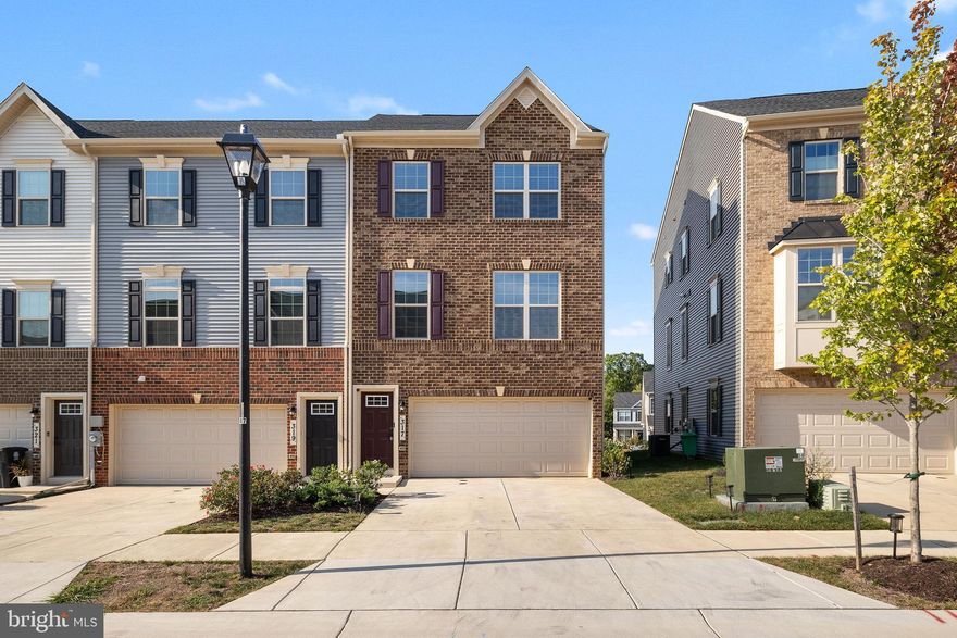 Welcome home! This absolutely stunning end-unit townhome built in 2022 is nestled in the Signature Club community. Boasting three levels of finished living space and two car garages with all the high-end details you would expect: high ceilings, recessed lighting, luxury vinyl plank flooring, neutral color palette, spacious room sizes, double deck, and design inspired finishes. The inviting curb appeal exterior and landscaping welcomes you into the warmly functional floor plan. The spacious entry level provides a family room with recessed lighting and access to the rear patio. The entry level also provides garage access to the convenient two car garage. Upstairs, the beautiful open concept main level awaits beginning with the centrally located kitchen. Prepare gourmet meals in the kitchen appointed with sleek 42-inch cabinetry, quartz counters, subway tile backsplash, pantry, entertainer’s island with seating, and stainless steel appliances including a gas cooktop and double wall oven. The living and dining rooms on either side of the kitchen make the space ideal for entertaining and everyday comfort with sun-loving windows with beautiful natural light. Travel upstairs to the luxurious primary bedroom offering recessed lighting, walk-in closet, and an en-suite bath with a double vanity, glass enclosed shower, and soaking tub. Two additional sizable bedrooms, a full bath, and the laundry room complete the upper level. Enjoy entertaining or relaxing on the large paver patio. Conveniently located community with easy access to Washington DC, Virginia, I-495, I-295, and MD- 210.