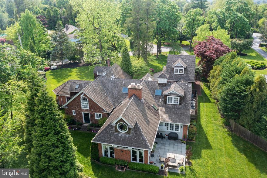 Welcome to the most charming Carriage House located in the coveted N. Villanova Estate area, on a private beautifully landscaped lot. This exceptional property seamlessly marries stately old-world charm with contemporary amenities, creating a residence of unparalleled timeless allure.  Spring Mill Ln is off of Spring Mill Rd and Mt Moro.
The current owners enlisted the expertise of Studio Agoos Lovera architects for an extensive renovation and addition. The end result was a seamless integration of modern conveniences into the historic framework of the 1938 built carriage home while preserving its heritage and enhancing its livability. Studio Agoos Lovera features this home in their portfolio and states: “This project involved renovations and additions to an historic carriage house in suburban Philadelphia. New construction included a family room, kitchen, playroom, and home theater, as well as a garage with guest apartment above connected to the main house by a breezeway. Renovations included conversion of the former kitchen space to a formal dining room and the complete renovation of the master bedroom suite. The design of the house was influenced greatly by the historical significance of the existing structure, and was required to comply with local historic ordinance requirements”. Recognized by the Historic Architectural Review Board, Lower Merion and awarded the prestigious Historic Preservation Award in 2009, this home stands as a testament to architectural excellence.

This charming red brick carriage house boasts an exceptional open floor plan, flooded with natural light and adorned with architectural details throughout. Enter the property through a tree lined drive and brick walled courtyard entrance with attached 2 car garage addition, adjoining glass enclosed breezeway, and a cupola on the cedar shake roof that features a horse weathervane. The front door opens into a foyer showcasing slate floors, a brick and beadboard wall, barn doors and hinged barn windows used in horse stables as feeding troughs. The entrance just oozes charm. These features are also found in the breezeway addition connecting the mud room to the garage with an apartment above. Back inside the large kitchen, that was part of the home addition, features a beamed, wood ceiling in white, a center island, breakfast nook and a two sided brick fireplace. On the other side of the fireplace, step down to the family room addition with glass windows/doors on 3 sides, beamed vaulted white ceilings, brick walls and wood floors and the 2 sided fireplace. Doors open to a large patio overlooking the landscaped yard. Also part of the addition, a playroom/office adjoins the kitchen. Completing the addition on the main floor is the mudroom with custom built- ins, a walk-in pantry with refrigerator, and laundry room. The original portion of the home includes the formal dining room that was converted from the previous kitchen, the living room with a full wet bar area, the library/office, a sunroom with walls of windows on three sides and a full bathroom. 

Ascend one of two stairwells to the second floor that features a renovated primary suite with ensuite bath. 3 additional bedrooms and 2 additional bathrooms are found on this level. The lower level renovation showcases a movie theater room, perfect for relaxing nights at home as well as an exercise room.   The above-garage apartment addition offers accommodations for guests or family and includes 1 bedroom, 1 full bathroom and a kitchenette.

This one acre property offers a level lot,  play areas, gardens, mature trees, and privacy, in a walkable neighborhood. Enjoy proximity to the renowned Lower Merion Township public schools and esteemed private schools in the area.  Area dining and shopping is just minutes away. The Villanova train station is within a mile and has service to Phila. and NYC.

1515 Spring Mill Lane is a truly unique Main Line gem!

Blueprints added to documents.