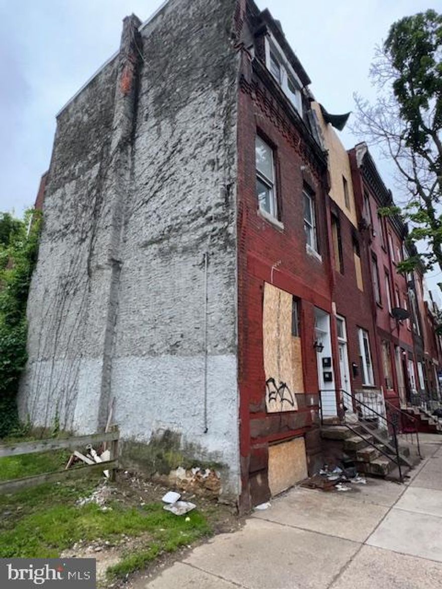 Great Investment Opportunity! This property is within walking distance to Temple University. Some rehab work has been done. Although currently zoned as a duplex, property was previously rented as a triplex and can easily be converted back. The adjacent lot is owned by the City of Philadelphia. Enter at your own risk, there currently is no electric at the property.