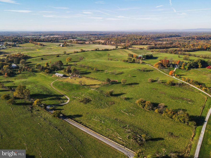 46.76+/- acres in land preservation.   Property has  large pole building for storage and cattle waterer.  Land is currently being used for a cattle operation.