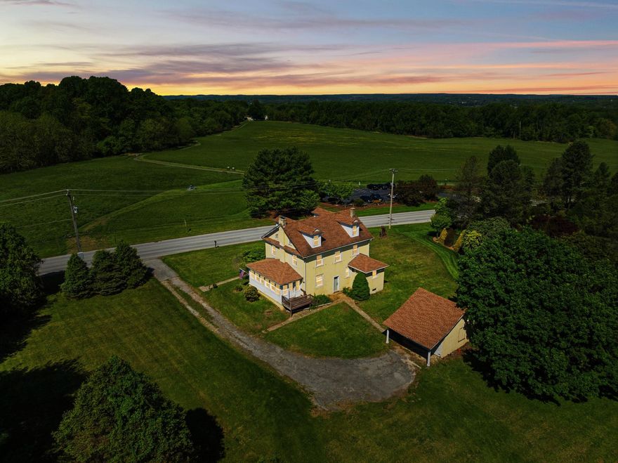 When listings talk about being a once in a lifetime opportunity to buy a historic and iconic home, they're usually exaggerating just a bit, but not this time. Nestled on top of the hill overlooking Sandy Hollow Heritage Park, 42 acres of open space with sweeping views of the countryside and located between historic Dilworthown and bustling West Chester stands the Charles Davis House. Built in 1926 and owned by just two families in 100 years. This stunning home is being offered for sale and it truly is a once-in-a-lifetime chance to make this house in the Unionville-Chadds Ford School District your home to cherish for years to come.

Walk up the front path through the graceful entrance columns and into the foyer which features a large coat closet by the stairs and doors into all the rooms on the first floor. To your right is the large living room with a wood burning fireplace, windows overlooking the park and the back yard and twin doors into the 3-season side porch. The porch is the same size as the living room and could easily be outfitted with splits for year-round use, with windows on 3 sides and a back entrance that goes to the side/back deck and then to the driveway.

Across the hallway from the living room and through the original French Doors with their antique key is a nice sized dining room with windows on 2 sides overlooking the park. As was common for this style of home, the kitchen is modestly sized and in the back of the home, it features vintage wood cabinets, enough space for a small table or island, and incredible views of the park from the window over the sink. 

Just off the kitchen is the laundry room with enough space for a stand-alone washer and dryer, and the large fridge, and the door to the downstairs full bath with shower. In the back of the house, off of the garage you have the back door which opens on to a landing where you can choose to walk down to the basement, or up a few steps into the kitchen. In addition to the laundry room upstairs, there's a massive double laundry or utility sink in the basement for washing large items and you could of course relocate the laundry back downstairs if desired. 

Up the original stars you have 4 nice size bedrooms, all of them have stunning views of the countryside with 3 having views of the park and the last one looking out over the local country road and backyard. Bedrooms all have original wood floors, doors and vintage light fixtures, one bedroom has double closets, the rest have a single closet. For the age of the home the closets are nicely sized and have more room than you might expect. 

The upstairs bathroom has a vintage iron / ceramic tub that is believed to be original to the house, the bathroom requires repairs and is not usable at this time. The house is being sold as-is with repairs in mind and with 1 full working bathroom with shower you could still live in the house while doing the work if desired. The bathroom is a nice size and you could either restore the tub and keep it or swap it out to something new.

Conveniently located on a country road you're still only minutes away from many major local travel routes with all of the shopping you'd expect and minutes to Delaware.

It's not often that you get the combination of a historic property, with sweeping protected views, good bones, original and period details that you can live in while restoring if desired. How many decades of sunrises and sunsets will you watch, how many generations of owners will call this place home and cherish the memories made here while enjoying the history of the local landscape.