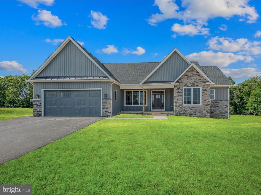 OPEN HOUSE CANCELED. PROPERTY UNDER CONTRACT. Introducing a sophisticated rancher nestled between Shepherdstown and Martinsburg, West Virginia - a captivating home offering a fusion of sleek contemporary elements and modern farmhouse flair. With 4 bedrooms and 2 full baths, this residence is thoughtfully designed to accommodate your lifestyle needs, providing ample space for relaxation and entertaining.

Upon entry, you'll immediately feel welcomed by the inviting ambiance of this farmhouse-inspired dwelling. The open floor plan seamlessly connects the living, dining, and kitchen areas, fostering an ideal setting for family gatherings and cherished memories. Natural light fills the interior, highlighting the refined finishes and earthy hues that grace every corner.

The kitchen, a focal point of the home, boasts sleek countertops, stainless steel appliances, and abundant cabinet space for all your culinary necessities. Whether preparing a quick meal or hosting a soirée, this kitchen is certain to impress even the most discerning guests.

Step into this inviting living room, where soaring vaulted ceilings create a sense of grandeur and space. Bathed in natural light streaming through expansive windows, this room exudes warmth and tranquility. Picture yourself lounging on the plush sofa enjoying the warmth of the fireplace during cooler evenings.

Beyond the expansive windows lies the tranquility of the countryside, offering stunning views of the lush surroundings. Step out onto the composite deck to savor the sights and sounds of nature, or dine al fresco in the privacy of the backyard oasis.

With two acres of land at your disposal, outdoor possibilities abound. Whether cultivating a garden, engaging in family recreation, or simply enjoying the surroundings, the options for enjoyment are endless.

The full unfinished walkout basement provides additional space for customization, whether as a home gym, media room, or guest suite - the choice is yours.

Backed by a serene tree line, this property offers a harmonious blend of seclusion and convenience. Escape the urban hustle while remaining within easy reach of local amenities, schools, and major thoroughfares.

Outside, the exterior exudes timeless elegance with its board and batten siding in soothing shades of grey and blue, complemented by earthy stone accents. Upon arrival, you'll be captivated by the allure and character emanating from every angle of this home.

In summary, this new single-level dwelling epitomizes modern luxury intertwined with sophisticated charm. With its generous layout, idyllic setting, and prime location, it presents an opportunity to realize your dreams of country living. Don't let this chance slip away