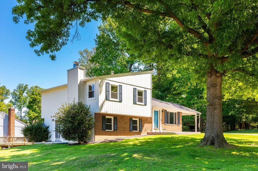 Welcome to 13201 Wilton Oaks Drive—tucked at the end of a quiet cul-de-sac and backing to county parkland, this beautifully updated home offers privacy, space, and convenience on a generous 10,919 sq ft corner lot. Featuring 4 bedrooms and 3 full bathrooms, this move-in ready home is designed for today’s lifestyle with flexible living spaces and an ideal layout for both everyday living and entertaining.

The light-filled main level features an open-concept floor plan with seamless flow between the living, dining, and kitchen areas—perfect for modern living. The fully renovated kitchen is a standout, complete with white shaker cabinetry, quartz countertops, stainless steel appliances, a center island with wine fridge, and a stylish tile backsplash. Hardwood floors run throughout the main and upper levels, adding warmth and continuity.

Upstairs, the spacious primary suite includes a private en suite bath, along with two additional bedrooms and a full hall bathroom. The lower level offers a large family room with a fireplace, plus a fourth bedroom with its own en suite bath and separate street-level entrance—ideal for guests, an au pair suite, in-law suite, or private home office. The additional lower-level basement provides even more versatility with a recreation room and dedicated laundry space—perfect for a home gym, playroom, or media room.

Outdoor living shines with a spacious deck off the kitchen, a large, tree-lined backyard, and a storage shed—ideal for entertaining or relaxing. A covered carport adds everyday convenience.

Ideally located a mile to Glenmont Metro Station, this home offers easy access to Washington, DC, with close proximity to Georgia Avenue, I-495 (Capital Beltway), and the ICC—making it a commuter’s dream. Enjoy nearby parks and trails including Wheaton Regional Park, Brookside Gardens, Brookside Nature Center, and Rock Creek Park.

A rare combination of cul-de-sac location, parkland views, Metro access, and updated living—this is one you won’t want to miss.
