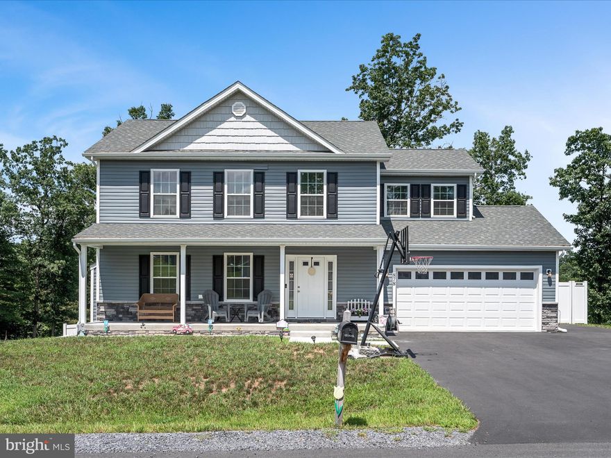 Welcome to this beautiful, almost new colonial home in the desirable Middle Creek Manor community. Step onto the inviting front porch and into a spacious main level featuring an open floor plan with stylish LVP flooring throughout. The living room offers a cozy fireplace and flows seamlessly into the modern kitchen, which boasts white cabinetry, granite countertops, stainless steel appliances, an island, and a dining area with access to the back deck—perfect for entertaining. Upstairs, you'll find four generously sized bedrooms, all with ceiling fans, including a luxurious primary suite with a tray ceiling, walk-in closet, and ensuite bath with dual vanity sinks. For added convenience, the laundry is also located on the upper level. The fully finished walk-out basement provides even more living space with durable LVP flooring. Outside, enjoy the fenced backyard with a shed for additional storage. This home truly has it all—space, style, convenient to commuter routes, and a fantastic location!