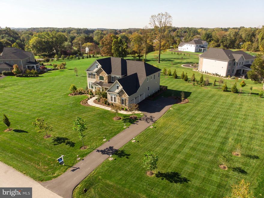 Top quality construction & finishes. Hardiplank(cement siding) with custom natural stone finishes, slate front porch & entry walkway + 2 luxury Trex decks(one covered & one open) with lighted stairs, + Energy-efficient appliances, windows & [SPRAY FOAM INSULATION in attic & all exterior walls, reducing energy bill by up to 20% + noise & allergen reduction and helps control humidity for a healthier home]  + 12 foot multi-panel pocket glass doors & 12 foot multi-panel stacking glass doors + Five full luxury bathrooms with Granite counters, ceramic tile & comfort height toilets + total square footage of home = 7700*   Major Energy efficient home with minimum exterior maintenance.   Impressive modern luxury home with resort-style landscaping($30K)and an over-sized three-car garage. A dramatic two-story foyer boasts a double sweeping staircase that connects six-bedrooms and five full bathrooms for 6400 finished square feet of luxury living. The main level boasts a sun filled Great room with a custom natural stone fireplace, coffer ceiling, custom moldings, built-ins, guest bedroom, full bath, luxury wood flooring, custom-designed mudroom, and multi-panel pocket glass doors, home office, dining room, luxury outdoor living areas. The Chefs kitchen offers stunning Quartz counter-tops, super-sized island, upgraded stainless steel appliances, six-burner gas stove, two ovens, extra-large pantries, and a custom built-in mudroom. The second level owners' suite boasts a large sitting room, elegant tray ceiling, dual walk-in closet's and deluxe bath with relaxing stand-alone soaking tub, luxury shower with dual shower heads, seats, and glass door. The second floor consists of three secondary bedrooms and two additional full bathrooms adorned in Granite counter-tops and ceramic tile. The second floor also offers a second family/playroom and a centrally located laundry room. Fully finished walkout lower level offers a bedroom, full bath, gym, yoga/craft room, and family room. All carpet has upgraded padding throughout, including the sunlit walkout lower level. Additional features include home security system, cat5, Wi-Fi hotspots on all three levels, Family room is pre-wired for surround sound; all windows have Low e gas, energy-efficient, Cement siding, spray foam insulation(attic and exterior walls) and professionally landscaped. The luxury outdoor living area consists of 2 Trex decks, one covered, and one open, offering lighted stairs. Most windows have Hunter Douglas plantation blinds, cordless wood blinds, or soft shades. Convenient country living, 1.4 mile to Safeway, Starbucks, Kooper's restaurant and many other amenities. Super close to Lock Raven Reservoir and Gunpowder Falls State Park. Surrounded by tons of golf courses. Eleven miles to Trader Joe's. Close to Towson. The homes overall square footage is 7700.