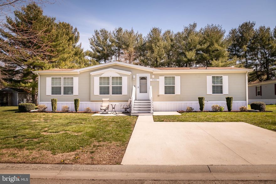 The seller requests best and final offers by Sunday, March 24th at 5 PM. Welcome to this well maintained 3-bedroom, 2-bathroom manufactured home located in the quiet, Colonial Mills Mobile Home Park in Delmar, MD. This home was built in 2008 and has been meticulously maintained with annual servicing and professional lawn care. When you pull up to the home, you will find a concrete parking pad for 2 vehicles with a walkway to the concrete patio. The front steps have been upgraded with vinyl handrails and trex decking floorboards. 

As you enter the home, you'll be greeted by the warmth of the living room, complete with laminate wood floors, a fireplace and bookshelves on both sides. The kitchen offers plenty of cabinets for storage and features a center island overlooking the dining room and living room. Through the kitchen you will find a large laundry room that ensures convenience and functionality, making household chores a breeze. The home offers a split floor plan with the spare bedrooms and hall bathroom on one side of the home and the master bedroom with its own private bathroom, oversized vanity and walk in shower on the other side of the home. With walk-in closets in all bedrooms, storage space is never an issue, offering organization and ease for daily living. Out the rear door, you will find a large back yard with two large sheds for additional storage. Call today to schedule a private tour!

This home is located in the Colonial Mills Mobile Home Park which requires park approval before a buyer can move into the park. The monthly lot rent is $460 per month which covers your water, sewer, trash, and property taxes.