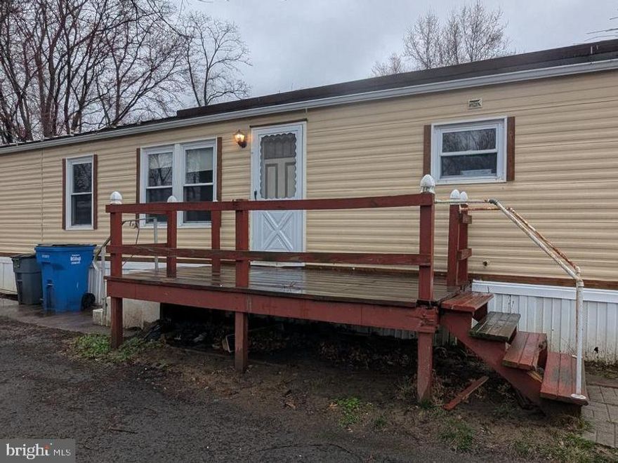 Step into this 2-bedroom, 1-bathroom mobile home, built in 1977, offering a fantastic opportunity to create the home of your dreams. While it may need TLC, this property comes equipped with a rare and valuable feature: a whole-house generator, ensuring peace of mind no matter the weather.
Located in a quiet and convenient community, this home has a practical layout with a comfortable living area, a large kitchen, and bedrooms that provide a sense of retreat. The exterior boasts a  small deck for enjoying the summer sun while drinking your favorite beverage. 
If you’re ready to roll up your sleeves and invest in a space full of promise and potential, this home is waiting for you. Property being sold AS IS with no repairs being made by seller.  Buyer Responsible for Bensalem Township U & O inspections and repairs. Schedule your showing today and envision the possibilities!