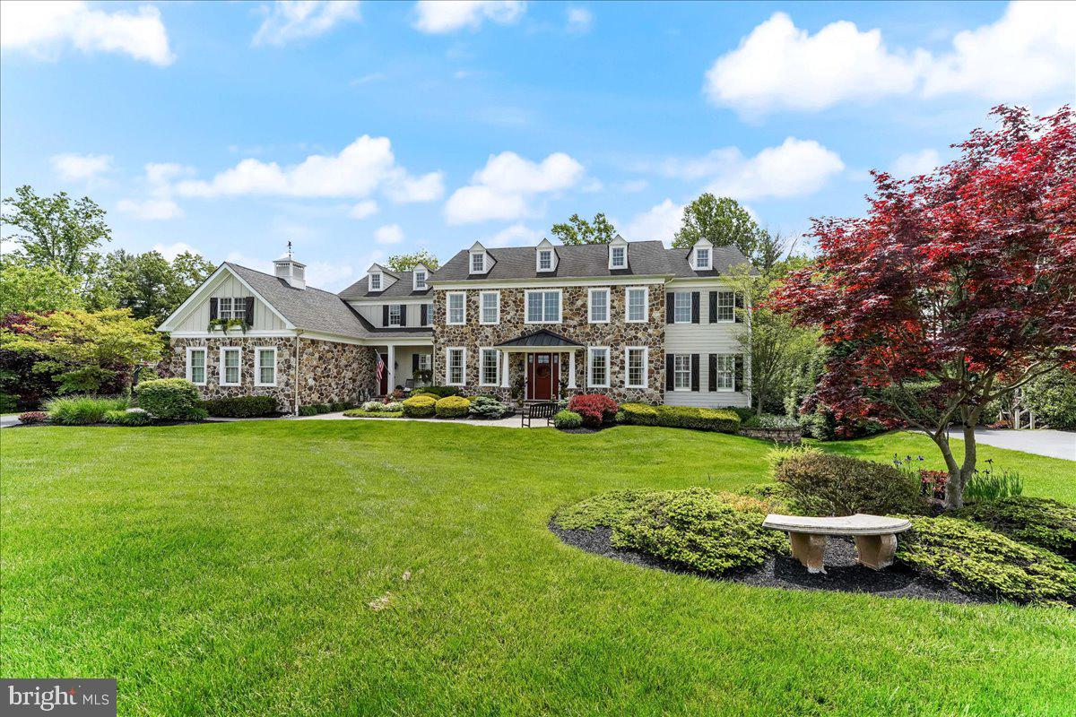 This stunning property offers a perfect blend of elegance, comfort, & tranquility. Nestled in the highly sought-after (& conveniently located) Estates at Chadds Ford community, this home presents a unique opportunity for luxurious living. From the moment you approach this grand colonial, the attention to detail is evident. The extensive fieldstone façade is complimented by the fiber cement siding, board & batten, and the charming cupola. As you approach the home on the custom paver walkway, you may enter via the formal main entry or the ancillary entry serving the mudroom. As you step inside the primary front door, you'll be captivated by the spacious, inviting layout. The dramatic foyer greets you with distressed wood floors & an impressive curved staircase with metal balusters & handsome wainscotting. Wood floors extend throughout most of the 1st floor including the adjacent Dining Room. The flexible floorplan has allowed the current owner to utilize the other adjacent room as an inviting & comfortable ‘coffee lounge’ complete with painted brick façade wall & decorative green-wall accent. The adjoining butlers pantry & bar (with sliding barn door) provide convenient access to all of your entertaining needs! Follow the rich wood floors to the expansive sunken Family Room with coffered ceiling, stone fireplace, and flanked by distressed barnwood columns. Adjacent to the family room is the fully renovated Kitchen complete with ample cabinetry, Viking gas range, GE Monagram refrigerator, and magnificent copper range hood. This custom kitchen offers timeless appeal with white cabinetry, Shaws farmhouse sink, Decora island cabinetry, abundant marble countertops and adjacent comfortable sitting area. It's a perfect place to unleash your culinary skills. The Kitchen also provides access to the handsome rear staircase, generously sized mudroom with gorgeous tile floor, and adjacent marble powder room. The western side of the 1st floor offers an additional fully renovated marble powder room, a sizeable 1st floor office with wood accent wall, and an enormous bonus room with plantation shutters, ample windows, built-in bookshelves, and versatile layout. Ascend the spacious staircase to the 2nd floor which offers access to each of the 5 bedrooms. Each bedroom is tastefully decorated & complete with its own on-suite bath & ample closet space with custom, built-in organizers. The main bedroom is also professionally decorated & complete with tray ceiling, adjacent sitting area, ample walk-in closet space (again with custom closet organizers), and exceptional five-piece tiled bath. Also, don’t forget the enormous storage room accessed through the walk-in closet. The finished storage room is versatile & can function however the new owner sees fit! For those that love to entertain, the finished lower level will astonish! The Great Room includes the finest of details, including stained wainscotting, wood columns, another stone fireplace, plentiful windows, and a tremendous bar/kitchenette with plenty of cabinetry, soapstone counters, & stainless steel appliances. Basement also includes a powder room, exercise room, theater room, & guest bedroom with on-suite bath & sitting area. Because of this home’s premium cul de sac lot, the home is afforded plenty of privacy & room for outdoor entertaining. The rear deck & hardscaping have wonderful views of the lush back yard & adjacent open space. The rear yard is fully fenced and perfect for all of your entertaining needs. Current owners have integrated a ‘built-in’ trampoline into the paver area (which offered their children years of enjoyment!). The area could offer a future continuation of the paver patio, or continue to provide trampoline fun for the new owners. Conveniently located, this home offers easy access to a variety of amenities. You'll be just moments away from shopping centers, dining options, recreational parks, & renowned schools. Set your appointment today!