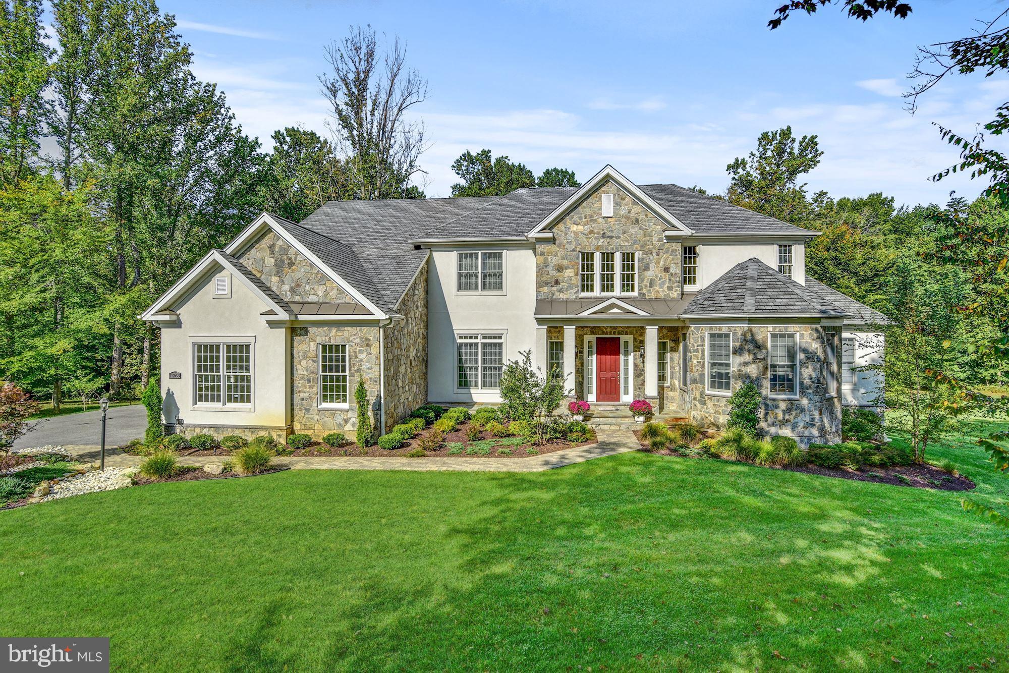 LUXURY LIVING CLOSE TO EVERYTHING! Enjoy a Dramatic 2-Story Foyer, gracious curved stairway, SPACIOUS formal LR & DR, Family room w/ tall stone fireplace & coffered ceil, Conservatory, Study & ELEVATOR. LUX Master bedroom with sitting area and upscaled bath with soaking tub. ALL EN-SUITE BRs up! Finished FULL-DAYLIGHT LOWER offers REC Rm, Exercise, STORAGE & walk-out. Paver patio, garden walls, deck &Gazebo back to trees on beautiful lot. Come home to indoor & outdoor comfort, convenience & LUXURY!