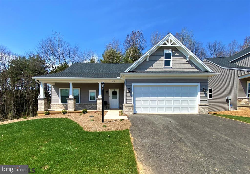 Prestigious Honors Crossing II BRAND NEW 5 bed, 4 bath ranch! Welcoming entry with covered porch, stepless entrance & 2-car garage! Half acre lot includes conservation easement for touch of nature behind home. Just MINUTES from Penn State and favorites like The Field, Toftrees Golf Resort & American Ale House! Inside is completely open concept filled with natural light, high ceilings & hardwood from entry to morning room! The modern kitchen has granite counters, abundant cabinetry, SS appliances & breakfast bar overlooking living area, featuring raised brick hearth & natural gas fireplace & patio doors to spacious deck! First-floor owner's suite has WIC, private bath with double vanity & soaking tub/shower. All baths have grab bars. Large upstairs loft for home office/gym & finished basement with wet bar and access to patio for entertaining or grilling! Seller offers lawn care!