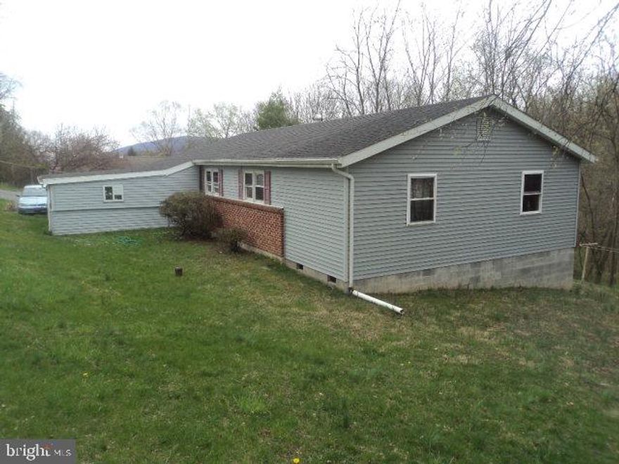 Ranch home with 3 to 4 Bedrooms- one captive, 2.5 baths, 1.5 on main level, 1 full on lower level w/2 Laundry rooms- main level & lower. This home has a wonderful private location in Lewistown. Attached carport, walk out lower level which is currently an in-law suite. Large kitchen with breakfast bar, dining room, open living room. Fresh paint, great condition and layout. Heat pump with central air new in 2009!