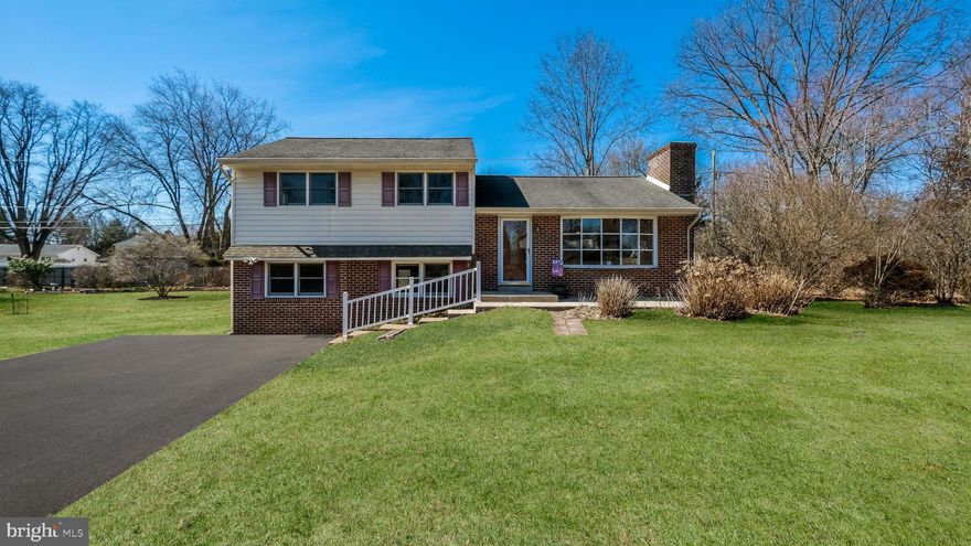 This POPULAR multi-zone brick front split-level Home is situated in a highly desirable neighborhood, offering impressive curb appeal. The main level features an open-concept Living and Dining area, ideal for hosting guests or enjoying family meals. The Living room is anchored by a floor-to-ceiling brick fireplace, while a large picture window floods the space with natural light. The adjacent Dining area seamlessly flows into the Kitchen, enhancing the home’s functional layout. Designed for efficiency, the Kitchen includes corner cabinetry and ample counter space, making meal preparation effortless. It also boasts updated stainless steel appliances. Hardwood flooring, under the carpets, extend throughout both the first and second floors, adding timeless appeal and durable, low-maintenance charm. The upper level offers three spacious bedrooms, each with exposed hardwood floors, double windows, and generous closet space. The hall bathroom is centrally located, providing easy access for the bedrooms ensuring comfort for everyone, complete with a large linen closet for added storage. Additionally, TWO walk-up attics offer abundant storage or the potential to be converted into a fourth bedroom suite. Back downstairs to the lower level, a standout feature is the expansive Family recreation room, providing plenty of space for various activities, gatherings, hobbies, or simply relaxation. Convenient Laundry room and powder room are connected and provides direct access to the backyard.  Those who enjoy outdoor living will appreciate the beautiful backyard and easy access to local parks and walking/hiking trails, while the front and back patios offer perfect spots for unwinding and hosting guests. A storage shed, located at the rear of the property,  provides a sheltered space for outdoor tools or garden items. This home offers a rare opportunity for buyers seeking a blend of traditional charm with easy access to local amenities, schools, shopping, and attractions. With a fresh coat of paint, you can easily add your personal touch and transform it into a space that reflects your vision...A little effort goes a long way in creating the perfect place to call HOME!