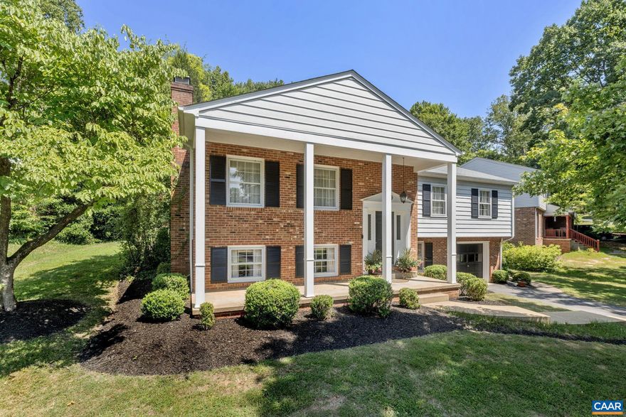 OPEN SUNDAY 1-3PM. First time on the market!  This home has been lovingly cared for and maintained by the original owners, and is ready for its makeover. With 5 bedrooms and 3 baths, as well as 2 living areas, there is room for everyone inside. Beautiful hardwood floors throughout the main level, including under the carpet.  Outside you'll find a spacious brick patio in the rear and a wide covered porch in the front, offering ample outdoor spaces.  Located in the popular and very established Woodbrook neighborhood and just down the street from Woodbrook Elementary School.  Mature landscaping and trees provide privacy and shade without obstructing the indoor light. Brand new AC unit! (Window ACs in the pictures were put in as an emergency measure while the owner waited for the new AC to be installed),Formica Counter,White Cabinets,Fireplace in Family Room,Fireplace in Living Room