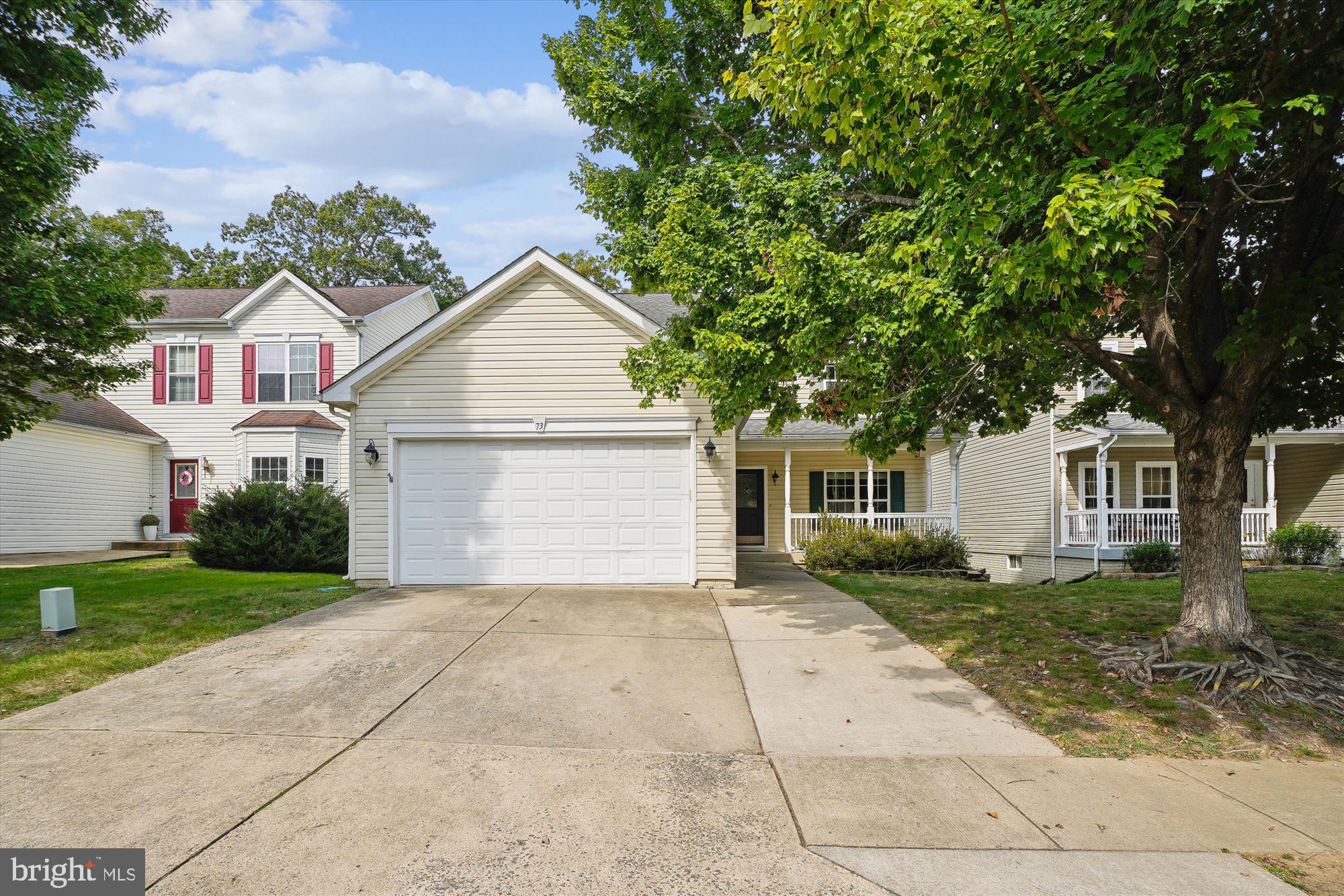 Beautiful 4-Bedroom Colonial in Stafford! The main level showcases gleaming hardwood floors throughout the formal living and dining rooms. A gourmet kitchen features stainless-steel appliances, a center island, and a sunny breakfast area. The inviting family room offers a cozy brick-front fireplace and access to the spacious back deck. Upstairs, you’ll find four bedrooms, including a primary suite with a private ensuite bath. Three additional bedrooms share a full hallway bath. Unfished basement, perfect for storage. The backyard is great for entertaining, with a large deck, stairs leading to a concrete patio, plus a separate wooden patio for even more outdoor living space. Shopping and commuter lots are just minutes away, and easy access to I-95 and Rt 1 makes commuting convenient.