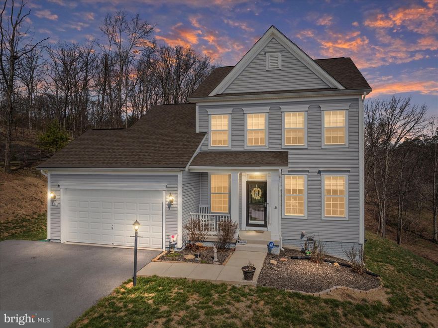 Beautiful one owner colonial featuring wood floors on the main level, and a basement with tons of room to grow! A formal dining room greets you, which can also be used as a study or office. The kitchen with lots of cabinets and an island is open to the vaulted living room with a cozy electric fireplace to warm yourself. There is room to add a deck off this level to enjoy your tree view in the back yard. Upstairs you'll find 3 bedrooms including a primary with en-suite, as well as the laundry. The basement offers plenty of space to add more living area, with a roughed in bathroom that already has drywall installed. You'll be just a one minute drive to beach 1 with the clubhouse, sports courts, marina, playground and more. Lake Holiday offers a ton of amenities from beaches, to a dog park, 18 hole disc golf course, all in a private gated community. Come vacation where you live!