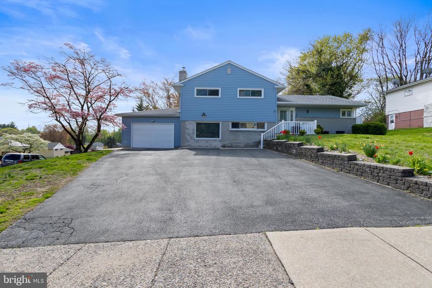 Welcome to this stunning 3-bedroom, 2.5-bath split-level home located in desirable Springfield, Delaware County. Situated on a prime corner lot, this property offers both space and style for modern living.

Step inside to discover a bright and airy open-concept main level featuring gleaming hardwood floors and a beautifully updated kitchen. The heart of the home, the kitchen boasts a large island perfect for entertaining, along with ample cabinetry and countertop space.

Upstairs, you’ll find three spacious bedrooms, including a primary suite with its own private bathroom. A full hall bathroom serves the additional bedrooms.

The lower level offers even more living space with a spacious family room, updated laundry area, a convenient half bath, and direct access to the garage.

Don’t miss this opportunity to own a move-in ready home in a sought-after neighborhood close to schools, shopping, and major routes. Schedule your showing today!