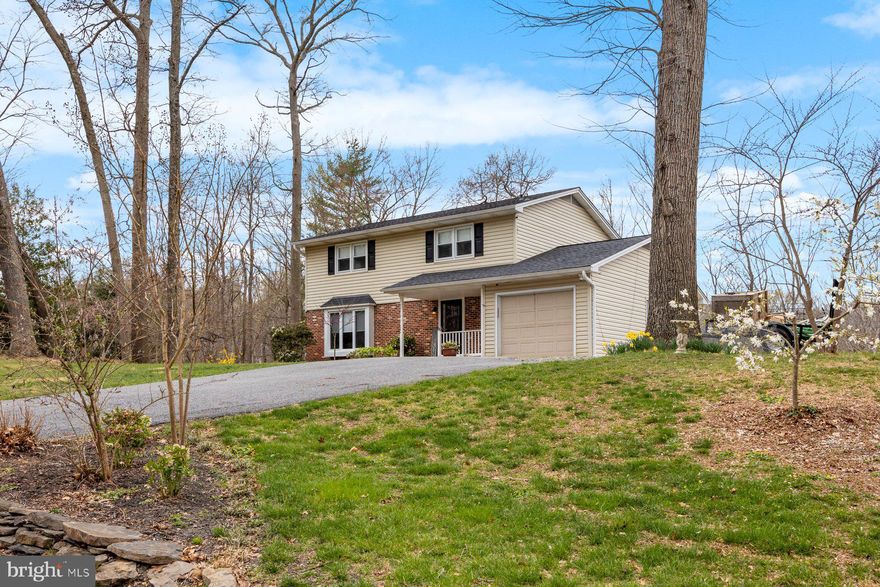 Welcome home to this  Beautiful 4 bedroom 2 full, 2 half bath Colonial with a 1 car attached garage. This home is located  on private 1 Acre lot that backs to trees with a  park like setting in the Warm neighborhood of Strawbridge Estates.  Features a traditional  floor plan with Large Living Room, Warm inviting Family Room  and Gorgeous Kitchen with Upgraded cabinets, counters  and Custom designed farmhouse pantry. Lower Level has custom designed stone and wood walls that are  absolutely Gorgeous!! There is also a room for possible office or playroom.  Upstairs has nice sized bedrooms with remodeled showers in the bathrooms.  Exterior has fenced in yard and deck for all your entertaining.  Kitchen was remodeled in 2018, New roof and gutters in 2021. This is a must see!!