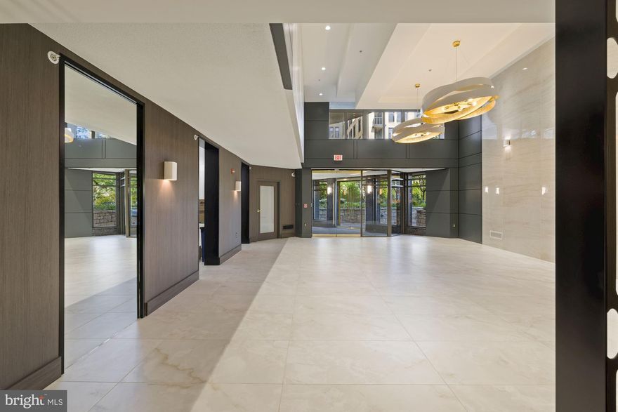 1BR + Den with private terrace and 2 garage parking spots. Everything you have been looking for in an apartment in the heart of Bethesda! With a unique open floor plan, this one-bedroom plus den features 950 sq. ft. of freshly painted living space. The updated kitchen includes a gas range and is open to a large living/dining area with gorgeous parquet floors. The sunny balcony is nestled in the trees overlooking the park for drinks alfresco. The den opens with French doors, providing nice light in this extra room perfect for a home office or additional bedroom. The inviting primary suite features large windows and a huge walk-in closet. The bathroom is tastefully updated and nicely sized. With a full-size stackable washer/dryer. The common areas and lobby were recently updated with a high-end luxury feel. There are two parks close by and a paved area to sit and meet, as well as a grassy dog park right out front for your furry best friend. Situated right in the hub of downtown Bethesda, a block from the main entrance of the Capital Crescent Trail. Enjoy hundreds of restaurants, movies, shops, metro, and the best of Bethesda at your door! Please contact the listing agent for application inquiries.