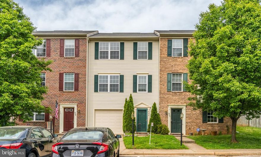 Wonderful 3-level town home that even has a garage and driveway parking.  Excellent location for commuting to Dahlgren, Northern Virginia, and DC.  So close to VRE and I95.  Beautiful and relaxing green space in front of your home w/walking trail, fountain, and play area.  This home has two large master bedrooms with luxury bathroom.  There is a huge living room with gas fireplace.  The kitchen is spacious with an island plus there is a dining area too.  Beautiful tile floor in kitchen and dining area.  So enjoy entertaining your friends and family.  Perfect deck to enjoy those spring and summer evenings or maybe even a barbecue.  Even has a storage shed under the deck.  The lower level has a room that is perfect as a media room, play room, den, or just additional storage.  Gorgeous hardwood staircase that goes from the main level to the upper floor.  You won't be disappointed when you tour.  Come see!!