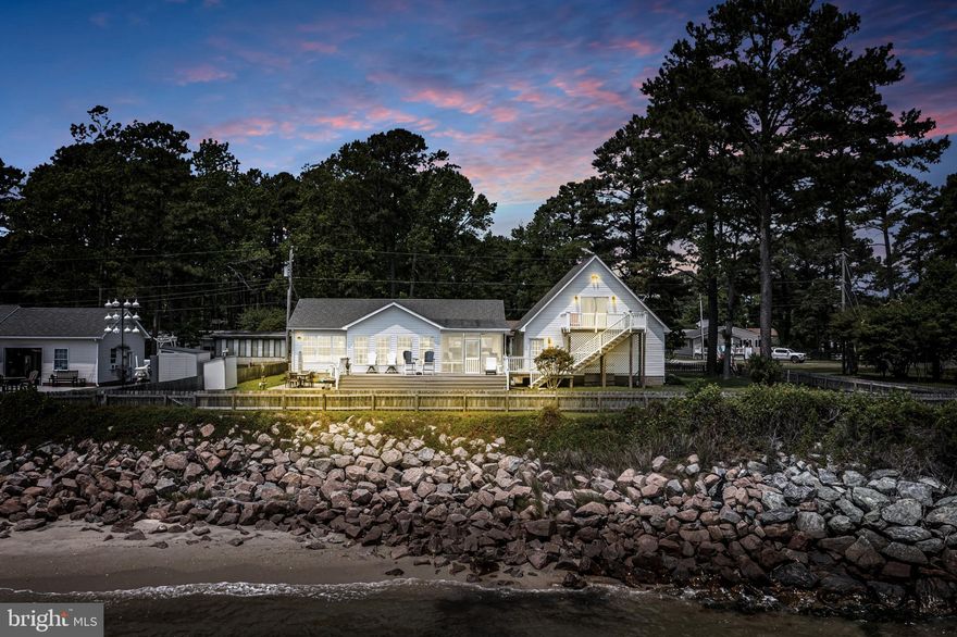 Discover the ULTIMATE COASTAL LIFESTYLE  in this beautifully maintained 3-bedroom, 4-bath waterfront home located in the serene community of Fleeton Beach. Perfectly positioned to capture panoramic views of the Chesapeake Bay , this stunning property offers both comfort and elegance—ideal for year-round living or a peaceful weekend escape. This area is a fisherman's dream! Rockfish, speckled trout, red drum, flounder and cobia are just some of the popular catches of the day! When you walk outside, all you have to do is cast into the water. Frequently you see fish jumping out of the water.   Once you catch the big one,  you can walk right into the garage and clean it in the deep sink, then on your gorgeous stamped patio...you can fire up the grill....dinner is served!

This home offers ROMANCE at its best!  Lay in bed and watch as the moon comes up over the water.  In the mornings, enjoy your coffee as the sun rises...and see DOLPHINS play in the surf! Have friends come over and enjoy the best views of the bay and relax on your deck and play yard games with this fantastic view!  THIS IS THE  PERFECT CHESAPEAKE BAY HOME! 

Step inside to an expansive open-concept main level, where light-filled living and dining areas flow seamlessly into a bright, well-appointed kitchen. Every room is designed to maximize the breathtaking water views. The spacious sunroom invites you to relax and unwind while watching the ever-changing tides, and the adjoining outdoor deck is perfect for al fresco dining or entertaining against a backdrop of wide water vistas.

On the main level you will find 2 generously sized bedrooms and 2 full bathrooms, including a luxurious primary suite complete with a private en-suite bath and sweeping bay views. Ample closet space and abundant natural light enhance the warmth and functionality of every room.

The oversized two-car garage features a full bathroom, deep sink, and a private apartment above—with its own deck—offering the perfect space for guests, rental income, or multigenerational living. The apartment has a large bedroom, full sized bathroom, partial kitchen and living room. There's also plenty of storage for kayaks,

Step outside to your own slice of paradise with a sandy shoreline and crystal-clear waters ideal for swimming, paddleboarding, fishing, or kayaking. Boaters will love the ability to anchor close to shore and walk directly to the house. A fenced yard adds privacy and is great for kids or pets.

Just minutes from the heart of Reedville, you’ll enjoy easy access to charming shops, waterfront restaurants, and marinas. Nearby towns like Heathsville and Kilmarnock offer fabulous dining, art galleries, nautical shops, a multi-million dollar entertainment complex called Compass which has fun for the whole family- a go kart track, mini-golf, rock wall, arcade games, batting cages and a luxurious movie theatre.   Route 360 ensures a smooth commute to Richmond which also has the nearest airport.  Many people will drive to this area from Northern Va., Richmond and Maryland. The coastal lifestyle here is worth the drive! This rural setting offers so much peace and tranquility, there is lots of recreation and no city traffic at all.  Once you see the local waterways, the wildlife and fields of flowers you are sure to fall in love!  Blue heron, snowy egrets, pelicans, osprey, swans,  bald eagles and eastern bluebirds are just some of the birds here!  

Rockfish, speckled trout, red drum, flounder and cobia are just some of the popular catches of the day! The Northern Neck of Va. is known for crabbing, boating, kayaking, swimming and soaking up the sun!