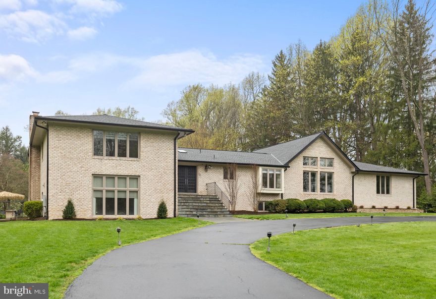 Please submit any offers by 2 PM on Monday April 8th. . Contemporary home w/3 car garage is sited on a spectacular flat, open 2+ acre lot within easy walking distance to Potomac Village. The private backyard is an oasis with an inground pool, outdoor kitchen/tiki bar plus open play spaces and fenced yard. Inside this custom-built home you will be wowed by the great room addition with vaulted cathedral ceilings, a gas fireplace and walls of windows overlooking the beautiful grounds. Spacious living areas include a formal living room with a wood burning fireplace and built-in wall cabinets, a separate dining room with French doors to the deck and a gourmet kitchen open to the great room. The upper level features a large primary suite with oversized bath plus 3 secondary bedrooms with 2 full bathrooms. The lower level offers several recreation spaces, two additional fireplaces plus a 5th bedroom with en-suite bathroom.  The trifecta of utilities which is unique for large Potomac lots awaits you - there's public water, public sewer and natural gas!  This home has been designed for formal entertaining or comfortable family living - don't miss it!