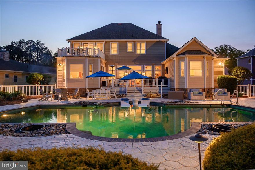 An exceptional home tucked deep within a pristine gated community, offering the ultimate in privacy and luxury. This large 4-bedroom, 3.5-bath residence boasts two primary master suites—one on the main level and one upstairs—perfect for multigenerational living or ultimate guest comfort. Step into the heart of the home: a chef’s dream kitchen featuring a Viking range with double ovens, high-end appliances, an expansive prep kitchen/butler’s pantry with its own refrigerator, dishwasher, custom shelving, and a generous island—ideal for entertaining. Enjoy the seamless flow of the open-concept layout with a spacious great room highlighted by a cozy gas fireplace, an elegant dining area, a sunroom, and multiple flexible office spaces. The outdoor living is just as impressive—a private fenced-in saltwater heated pool oasis with a surround-sound system, TV-equipped deck, outdoor fireplace, and fire pit, perfect for year-round enjoyment. Additional features include a 3-car garage, two laundry rooms (one on each level), a dedicated exercise/storage room, and a great boat slip with floating dock and kayak launch—just minutes from the sands of Ocean City beaches. This home is a rare find, offering both luxury and functionality in an unbeatable coastal location. Schedule your private tour today!