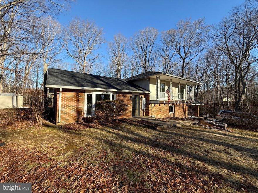 Your opportunity to have waterfront, water access and waterview in Fredericksburg, VA.  Beautiful single family 3 level home in a cul-de-sac and on 2.33 acres. New roof, new hot water tank, new windows and new HVAC - all in December 2025.  The roof is an architectural 30 year material with new boots, flashing, drip edge and ridge vent.  The HVAC is an electric Trane heat pump, and a 3.5 ton system with brand new duct work.  New interior and exterior doors.  Most of the flooring is a 22mil high-end Sterling Oak Waterproof Luxury Vinyl Planking.  But there is REAL hardwood flooring in the primary bedroom and polished marble in the primary bathroom.  New carpet and padding on lower level. The kitchen has been upgraded with new granite countertops, a pretty red pendant above kitchen sink and large custom pantry cabinet.   Laundry room makeover features GE 4.8 cu. ft. Smart White Front Load Washer with OdorBlock UltraFresh Vent System and  GE full-size large capacity 7.8 cu. ft. Smart Front Load Electric Dryer in White with Sanitize Cycle, ENERGY STAR..  New Dishwasher and New Electric Stove (30 in. 5 Burner Element Freestanding Electric Range in Stainless Steel with Dual Expandable Element and Quick Boil)   The rear kitchen door leads you to the custom pergola with egg chairs and fire pit convey, perfect for entertaining.... Fully fenced in rear yard with private access to the Pond.   All the hinges, door knobs, and door stoppers are new and matte black.   This 4 bedrooms and 2.5 bathroom home has 3 levels and plenty of room to spread out.  Beautiful features and fixtures make this a tasteful remodel.  Welcome home!