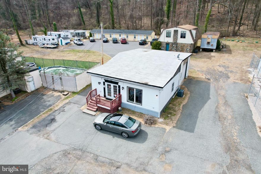 REDUCED!  Income Property opportunity, with great exposure on Belair Rd in Kingsville.  Property includes 10 rented residential units and 1 leased retail store.  Plus potential rent from 2 additional residential trailer licenses, along with a storage area and storage trailer. Septic System was replaced in 2024 using BAT technology.  Spring fed well is shared with an adjacent property.  Cell tower (on property) and Van Dorn Pools lot and building are NOT part of this sale.  Zoned BM.