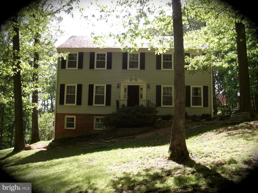 Secluded, well-maintained colonial SFH on 1.2 acres w/ attached 2-car garage.  Large rooms, hardwood floors, wood-burning fireplace, peaceful neighborhood, no HOA.  Sit on your deck overseeing large yard backing to trees.  Separate laundry room with laundry chute.  Pets approved on case-by-case basis.  Just off Rt 234 bypass; excellent commuter options to DC, Pentagon, Ft Belvoir, Quantico.