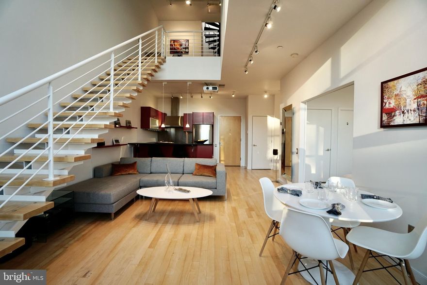 Welcome to this stunning two bedroom, two full bath boutique condominium in the heart of Adams Morgan, but tucked away from the noise.   Adams Lofts has just 12 exclusive units across from Harris Teeter. This sun-filled loft-style condo, facing west, offers stunning sunset views and boasts 20-foot ceilings in the living area with large atrium windows, a gourmet kitchen with stone countertops and high-end cabinetry.  The first floor has one full bath with jack and jill access to the 1st floor bedroom, which is separated from the living room with sliding glass panels, there is patio and a grill on the 1st level in addition to the roofdeck.

Upstairs there is a dedicated office space overlooking the living area.  The primary suite features sliding glass privacy panels, a walk-in closet, and a modern  bathroom with dual shower heads. The unit is sleek, modern and with the lutron electric shades and two retractable screens and projectors is an entertainer’s delight.  The  private roofdeck was just updated with new decking and trellis and is truly a private paradise with plenty of room for dining and entertaining alfresco. 

An assigned garage parking space is included, as is secure bicycle storage, and a private 5' x 8' storage space off the roof deck. Completed in 2005, this three-story building, formerly the Colortone Printing Building, offers modern residences with top-notch features, privacy and unmatched views in the heart of Adams Morgan.

APPLICATION LINK -  https://apply.link/MQB8350