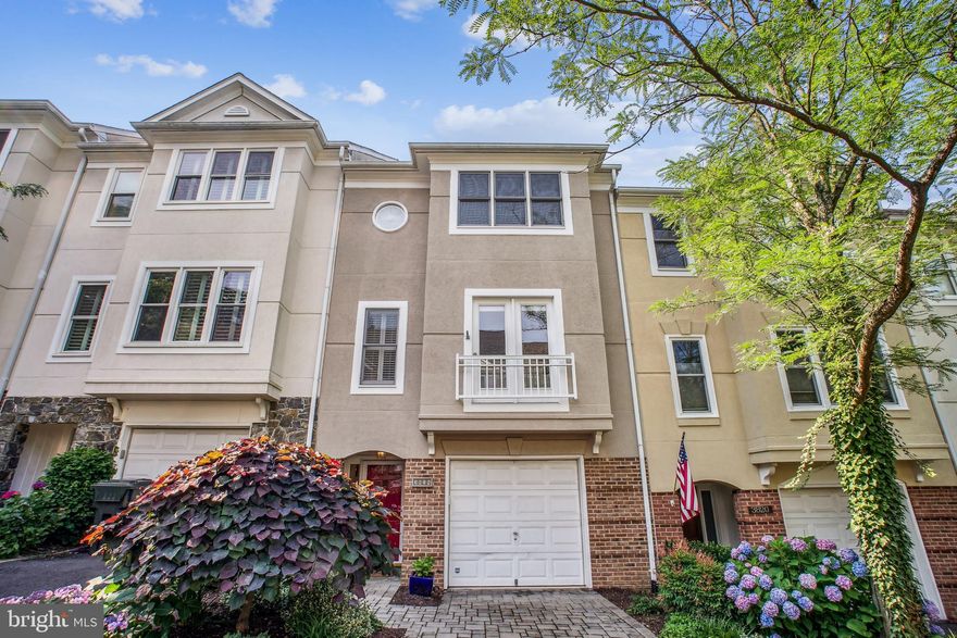 Between Alexandria's historic Old Town and the city's bustling West End lies a tree-covered, hillside neighborhood like an oasis from the crush of urban life. Early Street Village features 30 townhouses in a unique architectural blend of classic and contemporary features, with 3818 White Post Court the best model in the community – a luxurious delight that rarely comes on the market. This freshly painted townhouse features: a light-filled living room  with built-in bookcases, hardwood floors and French doors that look out on the well-manicured front garden and hand-laid stone driveway that leads you into a generous one-car garage.  A double-sided fireplace warms both the living room and formal dining room for intimate evening meals. An upgraded kitchen sparkles with new quartz countertops, a new stainless-steel gas stove, stainless-steel refrigerator, Bosch dishwasher and durable, water-resistant luxury vinyl plank (LVP) floors with the look of wood. The kitchen opens to a sun-soaked patio perfect for summertime entertainment. The home boasts three spacious bedrooms, each with an ensuite bathroom. The primary bedroom includes a walk-in closet, and the adjoining bathroom has a soaking tub and separate shower. A laundry room is located on the primary bedroom level. The red front door opens into a welcoming foyer that leads to an office-den with a half bathroom.  Early Street Village is located around the corner from the Alexandria Police Department on Wheeler Avenue and a fire station on Duke Street. The neighborhood is also close to Port City Brewery, Alexandria’s premier craft-beer brewery and pub, the Smoking Kow BBQ, which The Washington Post rated the No. 1 hickory-smoked barbeque in the area, and the famous Frank Pepe Pizzeria. You can rent bikes or buy unique Oriental rugs across the street from the Village. You can linger in the adjacent park and walk the wooded trails around the hillside.