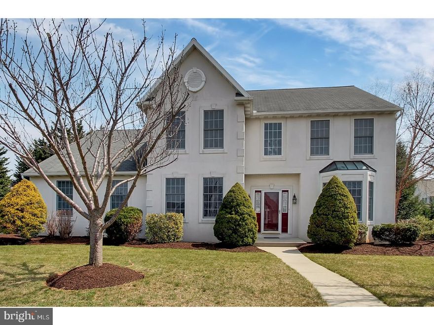 Gorgeous in Spring Ridge!  This immaculate and spacious home opens into a dramatic 2-story foyer with beautiful new Maple hardwood flooring running through the living room, formal dining room, and private first floor den/office.  The kitchen is equally impressive with beautiful granite counter tops and tiled back splash, stainless steel appliances, and breakfast island, all in an open concept that ties seamlessly into the family room with a vaulted ceiling, skylights, gas fireplace, Brazilian Cherry hardwood floors, and a wall of windows. Upstairs you will find four large bedrooms, a double sink hallway bath and an upgraded master bedroom suite complete with a walk-in closet, and full bath with tiled shower and soaking tub. Outside you will find mature landscaping, a partially covered deck with skylights and a ceiling fan and a nice, flat semi-private back yard. Call today for your private showing. One year HMS Home Warranty included.