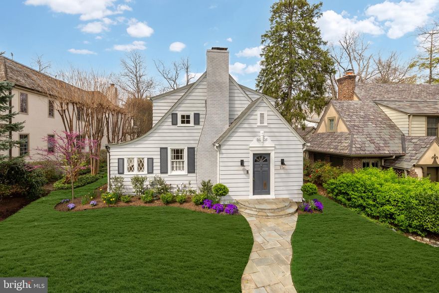 A mere block to the DC line, in the heart of verdant, historic, renowned Chevy Chase Village, 111 Oxford Street is a charming cottage-style home representing the culmination of character and livability. Originally constructed in 1926 and comprehensively reimagined over the years, the home evokes a storybook essence of perfection and is sited on a large, 7,487 square foot lot. A flagstone walkway approaches the offset front entrance, bringing to attention the beveled siding with mitered corners as a testament to the level of craftsmanship ingrained within. A dedicated vestibule with integrated storage then introduces an ethereal floor plan spanning a generous 3,200 square feet of light-filled living space. The large formal living room is a central gathering space, branching off to the rest of the main level and anchored by a roaring fireplace framed by intricate plasterwork. Devenco shutters, manufactured for numerous historic landmarks throughout the country, are found throughout. The adjacent library has a fully coastal ambiance, with a wall of windows facing a shingle wall, complemented by a shiplap ceiling. A stylish full bath with floor-to-ceiling subway tiled shower is at one end of the space. The central dining room has effortless flow from all directions and is adjacent to the chef’s kitchen. Featuring light shaker cabinetry, white quartz countertops, and a subway tile backsplash, the space is bright and airy. A professional appliance package includes a Miele induction range, Wolf hood, Bosch dishwasher, Grohe Blue filtered and sparkling water dispenser, and stunning La Marzocco espresso machine built in. The adjacent breakfast area can be closed off via pocket doors for intimacy and offers direct access to the screened porch. With two walls of glass, the family room is a generously proportioned space which maintains a level of coziness. A set of French doors opens directly onto the rear grounds. Danish audiophile Dali speakers are integrated within the family room’s home cinema setup and the screened porch. The upper-level primary suite is a complete oasis and features a private office which can be closed off by pocket doors. The primary bath is spa-inspired, with a thermostat-controlled radiant heated floor, freestanding tub, floating dual vanity, rain shower, and heated towel rack. A generous walk-in closet with built-in organizers completes the suite. Two additional bedrooms on the upper level share a hall bath. The lower level is dominated by an open, multipurpose recreation room. Suitable as a fitness center, playroom, or relaxation studio, the space features a full-size washer and dryer as well as a dedicated full bath. Tankless water, multiple split units, and Verizon gigabit fiber optic internet are modern upgrades greatly enhancing the home’s usability. Out back, the rear deck steps down onto a flagstone patio and grilling area, ideal for dining al fresco on warm summer nights. The lawn is level, lush, and usable. A comprehensive Rainbird irrigation system ensures the landscaping stays fresh. At the rear of the property, accessed directly via the alleyway, is a garage and parking pad. Equipped with a ChargePoint Level 2 system, new smart garage door, and new concrete floor with epoxy paint, the area is an automobile enthusiast’s dream and a luxury in such a close-in location. 111 Oxford Street blends historical significance and contemporary amenities in a polished package.