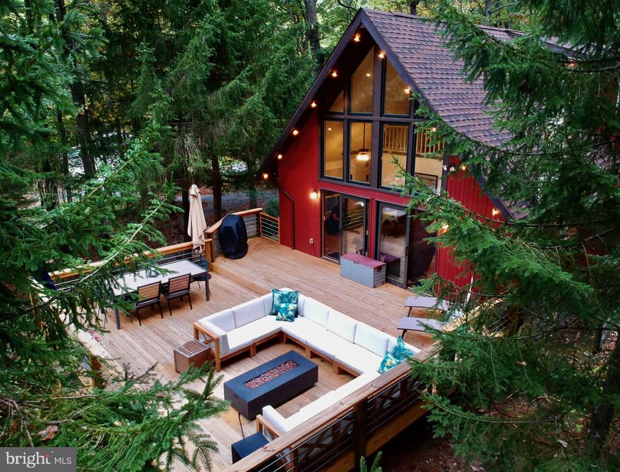 This charming 3BR, 3BA riverfront chalet property on the banks of Lost River is truly unique.  Brandon's Bunkhouse  is a popular Airbnb and will make a great income producing property but you may just want to keep it all to yourself for a private getaway that can't be beat.   Fish, kayak or hike up the side of the mountain and enjoy the relaxation of the river and the trees.  The floor to ceiling windows in the living room let you enjoy the view and there's easy access to the deck that's perfect for entertaining friends.  Plenty of space for everyone with two spacious bedrooms on the main floor and upstairs is a private retreat with the primary bedroom, bath, dressing room and bonus room.  The primary bedroom has it's own private balcony the leads out to a trail that takes you up to explore the forest .  Primary bath includes walk in shower and jacuzzi tub that lets you watch the deer and squirrels.  All this only 2 hours from DC, near National Forest, Trout Pond Recreation Area, Warden Lake and Lost River State Park.  Nearby Wardensville and Lost River provide restaurants and shopping for your convenience.  GIS is not accurate for the location and boundaries of this property.  Please use plats in documents.