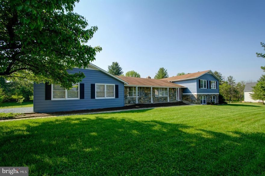 PRICE DROP! Wonderful "close to town" Lovettsville location!  All new interior paint  throughout the house. New carpet! So much has been done to this home. All rooms large and spacious. Hardwoods on main level. Huge deck with nice views of the serene yard with creek and small bridge. 2nd kitchen in lower level - many possibilities! 4 bedrooms up, 1 bedroom down. Just a little TLC - make it yours!