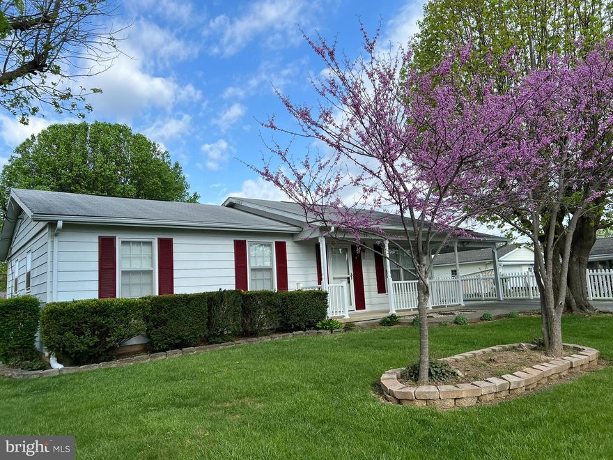 Classic and cozy rancher style home offering three bedrooms and one bathroom.  Fresh paint brightens the fully equipped eat-in kitchen, bathroom, and bedrooms.  The full basement is multi-functional, offering finished space to entertain and unfinished space for your storage and utility needs.  Convenient covered car port accessed through the kitchen will keep your vehicle from the elements. Find more space from the covered front porch and the covered rear deck, both offering room for outdoor furniture and enjoyment.  The level, smartly landscaped lot is complete with a shed and is located in an established neighborhood.  Minutes from the in-town conveniences of shopping, restaurants and medical facilities.