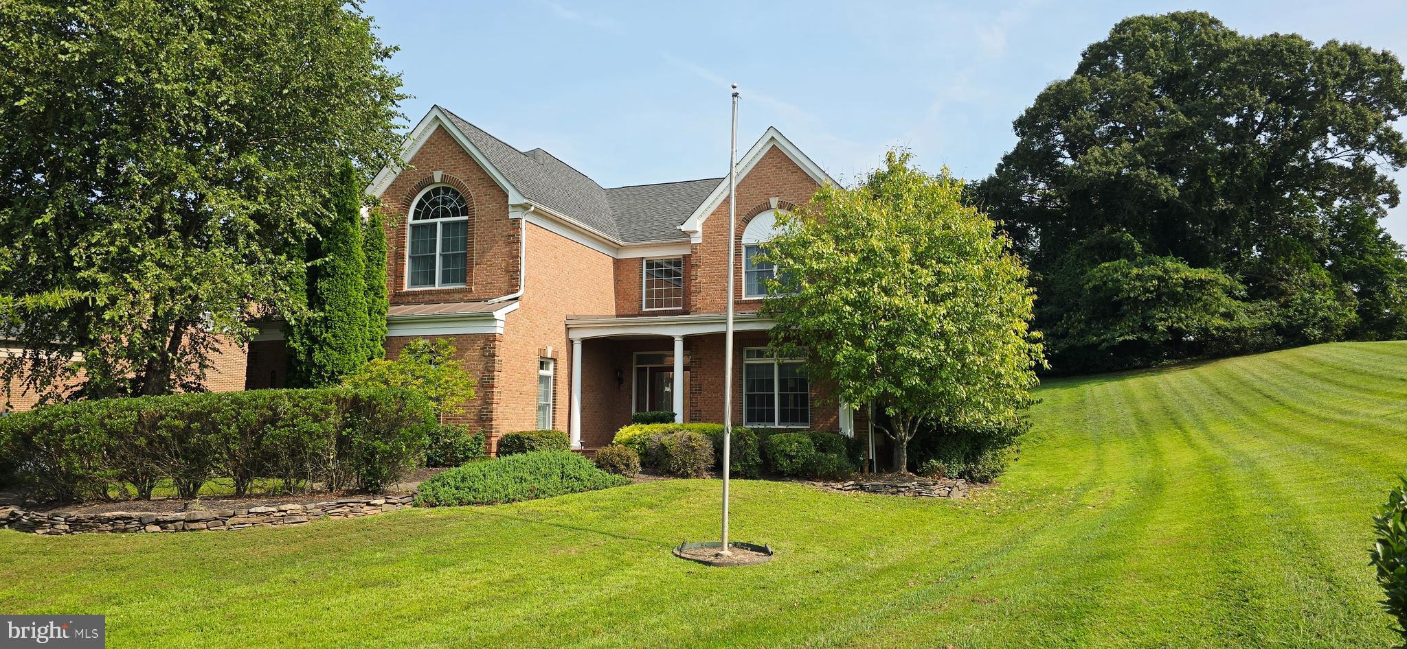Welcome Home! Former Model with Nearly 6,000 Sq. Ft. of Luxury Living.
This beautifully maintained 5-bedroom, 5-bathroom home is loaded with upgrades and sits gracefully on a corner lot. Step into the grand foyer, which opens to formal living and dining rooms and showcases a striking double staircase.
The heart of the home is the spectacular two-story family room, a signature feature of this former model. The main level also includes a bedroom with a full bathroom—ideal for guests or a private office. The gourmet kitchen is designed for both entertaining and culinary creativity, featuring soft-close cabinets, under-cabinet lighting, granite countertops, stainless-steel appliances, and a wall oven. Off the kitchen, a light-filled conservatory offers the perfect spot to relax and enjoy scenic views.
Upstairs, the spacious primary suite boasts two walk-in closets, dual vanities, a jetted tub, and a separate shower.
The finished basement is an entertainer’s dream with a custom wraparound wet bar, full bathroom, exercise room/flex space, and unique brick detailing.
Enjoy the outdoors on the large patio with family and friends.
Special Features & Upgrades Include:
Remote-controlled blinds in the foyer and two-story family room,
Motorized entry chandelier for easy cleaning and bulb replacement,
Holiday light switches under each window, all controlled at once,
Extended main-level laundry room,
Overhead storage in the side-load two-car garage,
Garage TV connection,
Custom office with French doors on the upper level,
Loft area on the upper level,
Whole-house humidifier,
Custom basement brickwork and bar,
Nestled in a premier equestrian community, this home offers elegance, comfort, and thoughtful details at every turn