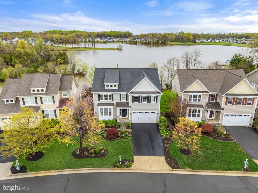 Wow, what a view from the moment you enter this home!!!  This lakefront home built by Lakeside Homes leaves nothing to be desired!  Gourmet kitchen with all KitchenAid appliances, large granite island with prep sink, stone fireplace, 5” hickory hardwood on the main floor, Hardie plank siding with stone foundation, and much more.  Lower level features  walkout to covered flagstone patio and 9' ceilings to keep the home feeling open and bright with natural light. Enjoy your lake view from the sunroom, screened porch, deck, and covered patio, even from the primary bedroom. No backyard neighbors except for the eagles, herons, turtles, swans, egrets, etc. Mature and extensive low maintenance landscaping with sprinkler system gives the home special curb appeal. Well-kept outside and in, this home is ready for its new owners to get cozy or to entertain. Enjoy all Brookside has to offer in views, amenities and location. In addition you'll be within walking distance to the pools, club house and exercise rooms!