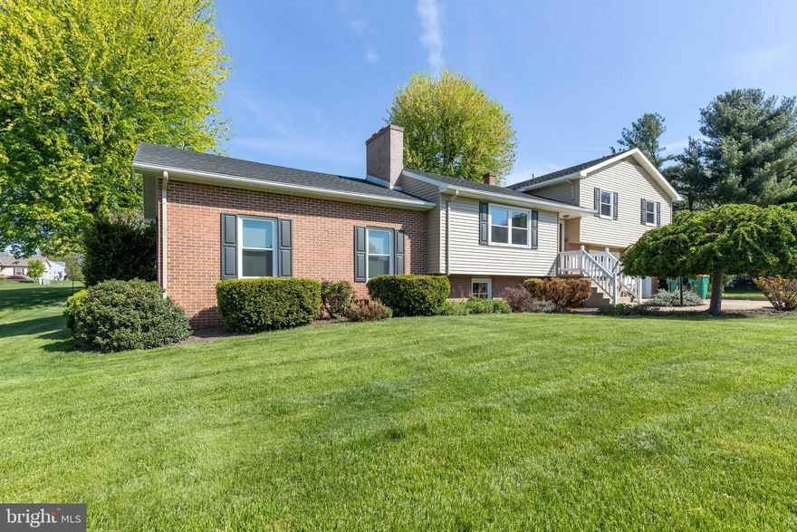 Welcome to 547 Garman Drive located in Chambersburg, Pa between South Guilford Hills and Falling Spring Elementary School. Only minutes away from Wal-Mart, this location offers immediate access to a great portion of the east end of Chambersburg. Positioned on a double lot and almost a full acre of land(.98 acres), there is plenty of acreage for outdoor activities or hosting picnics. Currently, a bee hive stand for making honey is located in the back yard. Within the home you will find a unique floorplan with four tiered living. This house includes three bedrooms, two and half bathrooms, two living rooms, a beautiful kitchen, two woodburning fireplaces, and partially finished basement. The grand living room is a must see as it receives copious amounts of natural light, vaulted ceilings, its own full bathroom, and outside excess. The sizeable kitchen runs the back side of the home and offers a built in pantry and both garage and deck access.