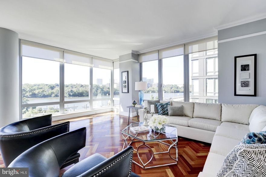 Stunning 3 BR, 3.5 BA unit at the Ritz Residences with sweeping views of the Potomac River, 2 car garage parking and all the amenities of the Ritz Carlton Hotels. Entry foyer features marble floors, the large living room has beautiful hardwood floors and windows showcasing the view. Formal dining room leads to the gourmet kitchen. Luxurious master suite with large walk-in closet and bathroom.