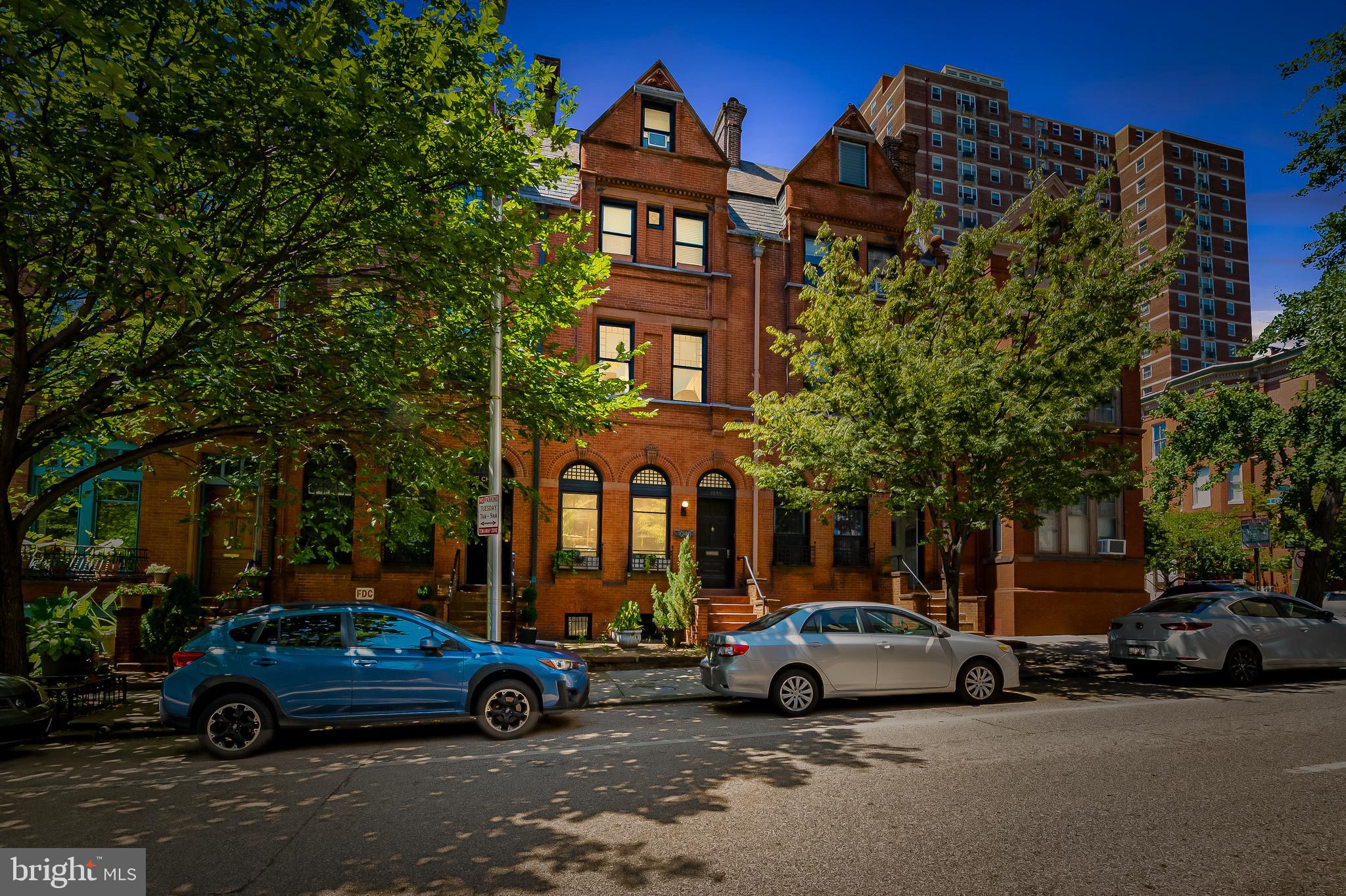 Welcome to 1040 N Calvert Street, part of the historic Belvidere Terrace one of Mount Vernons most distinguished and storied rows. Built in the late 19th century as Baltimore was flourishing, Belvidere Terrace was designed to embody elegance, craftsmanship, and a sense of permanence. Each home along this block tells a story of the citys golden age, when Mount Vernon was the cultural and residential heart of Baltimores most prominent families.
At 1040 N Calvert, you experience that legacy the moment you step inside. Soaring ceilings, intricate woodwork, and tall windows recall the grandeur of a bygone era, while thoughtful updates provide the comfort and flexibility of modern living. The double living room is as suited to hosting salons and gatherings as it is to curling up with a book, reflecting the tradition of entertaining and intellectual exchange that Mount Vernon is known for.
The chefs kitchen carries that same spirit forward. With its expansive island, custom storage, and seamless flow to the dining area and rear garden, its a true gathering space one that invites both lively dinner parties and intimate nights at home. Imagine walking back from the local farmers market on a Sunday morning, preparing a meal with friends in your large dining room.
The upper floors offer room to spread out. The primary suite provides a calm retreat, with space for a dressing area or reading nook. Additional bedrooms are large and versatile, perfect for home offices, guest suites, or creative studios. The top floor loft brims with possibilities a yoga retreat, a playroom, or an artists atelier under the light of the city.
The outdoor garden and patio are rare finds in this neighborhood, offering a private sanctuary for morning coffee, summer dinners, or evenings under the stars all while being right in the middle of the city.
Living here means being part of the legacy of Mount Vernon and Belvidere Terrace. Just steps away are the Peabody Institute, Walters Art Museum, and the citys first Washington Monument. Cultural life thrives at your doorstep, with theaters, galleries, and Baltimores finest dining within easy reach. And with Penn Station nearby, youre seamlessly connected to Washington, Philadelphia, and New York.
1040 N Calvert Street is more than a home its a piece of Baltimores living history, blending 19th-century grandeur with the lifestyle of today.