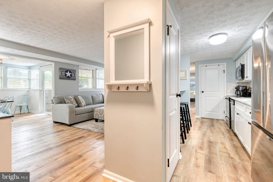 Enjoy easy living just minutes from the water and Annapolis.  This beautifully updated 2 bedroom 1 bath first floor condo is ideally located just 6 miles from the United States Naval Academy and close to the Magothy River and Chesapeake Bay making boating fishing and paddleboarding part of your everyday lifestyle.  Nearby marinas and local favorites like Sandy Point State Park make it easy to enjoy the outdoors.  Inside the home features durable luxury vinyl plank flooring throughout creating a clean low maintenance living space.  The kitchen has been thoughtfully updated with beautiful cabinetry updated countertops a designer backsplash and new stainless steel appliances perfect for everyday living and entertaining.  The windows and sliding glass door were also replaced/updated.  Enjoy the ease of one level living with a functional layout warm inviting spaces and true move in ready condition.  The building offers secure entry for added comfort and the community is surrounded by mature trees with plenty of parking available for residents and guests.  Conveniently located near Annapolis with easy access to Baltimore Washington and the Eastern Shore of Maryland Shopping dining and everyday conveniences are close by including Arnold Station Bay Dale Shopping Center Westfield Annapolis Mall and nearby Severna Park.  A great opportunity for low maintenance living with easy access to the Annapolis and Chesapeake Bay lifestyle.  OPEN HOUSE Sat, April 25th from 1:00 to 3:00