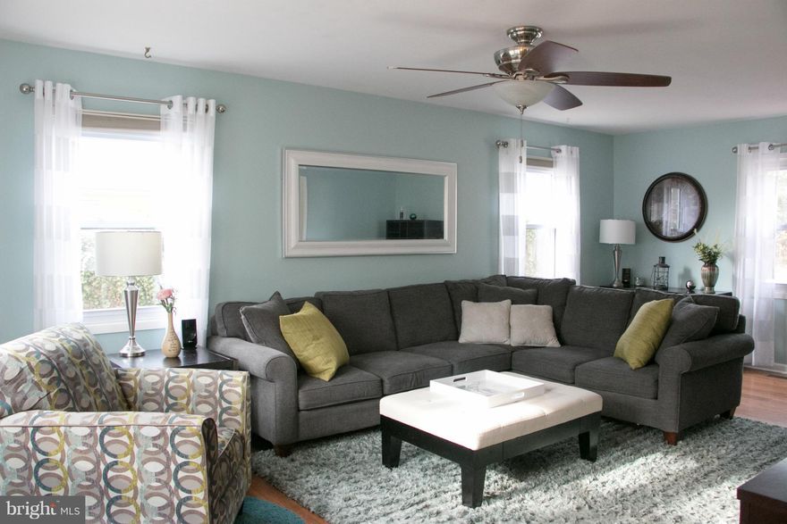 OPEN SUNDAY,Feb 26, 1-3! This one is light, bright, beautiful and inviting! 3 bedroom, 2.5 bath with garage. Sliders by eat-in kitchen open to awesome fully fenced backyard w/custom deck and patio. Wood Floors throughout! Open Kitchen with eating area. Separate dining room. Updated baths. Master bedroom with 2 closets & full private bath. Tons of light!! Storage shed. Priced right to sell quickly!